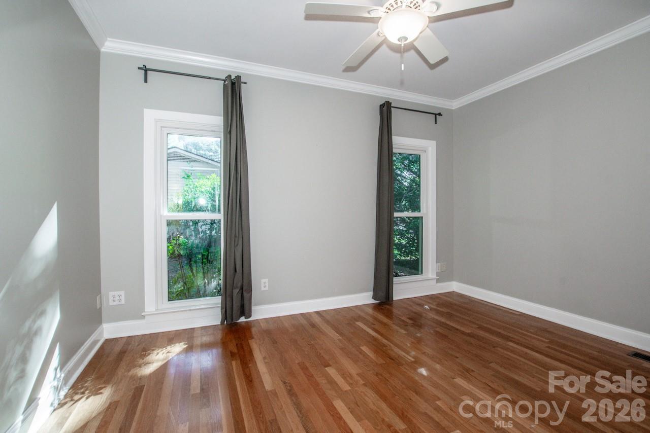 Large secondary bedroom with crown molding and hardwoods - 351 Catalina Drive, Mooresville