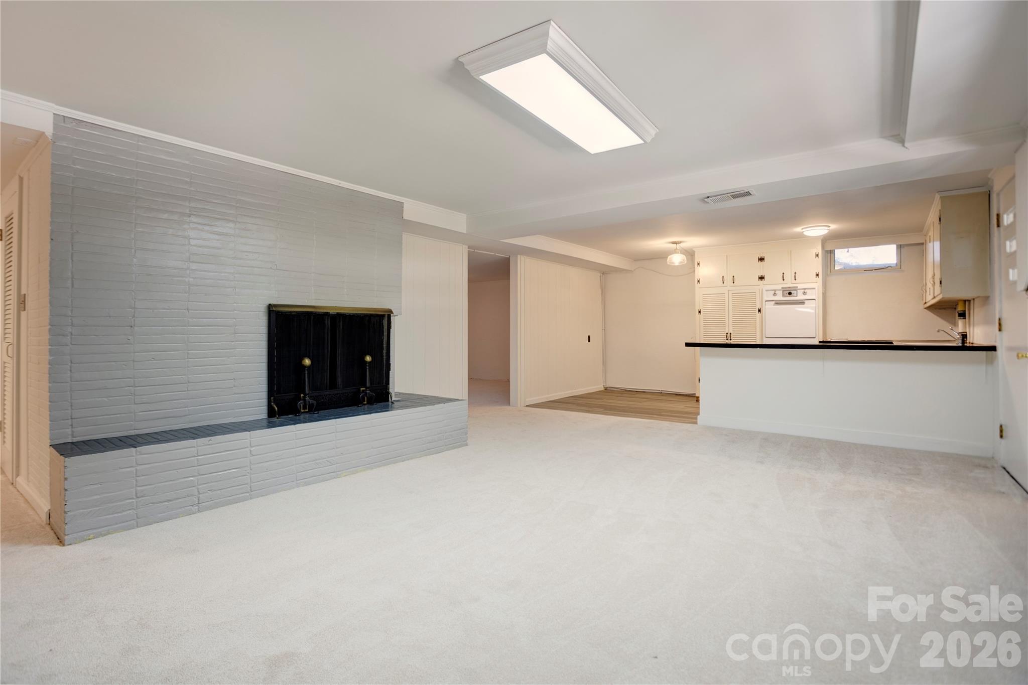 Family room/kitchen flow (basement) - 688 Grandview Drive NE, Concord