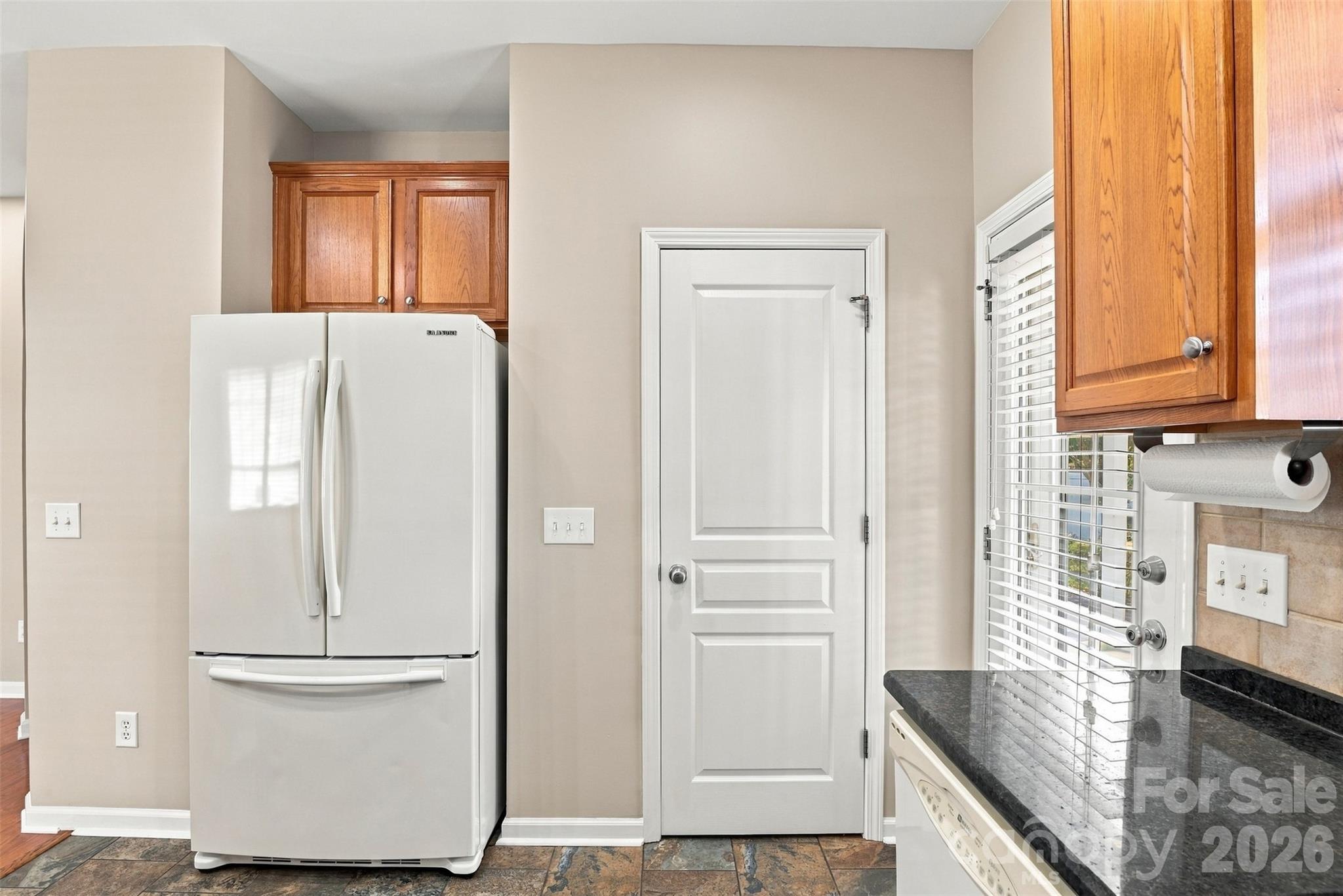 Pantry in kitchen and back door leading to the fenced in gardens in the back yard! - 608 Goldflower Drive, Rock Hill