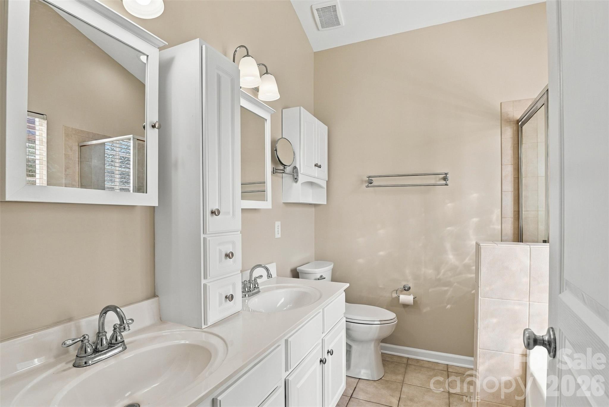 Primary bathroom with extra storage, separate shower and soaking tub! - 608 Goldflower Drive, Rock Hill