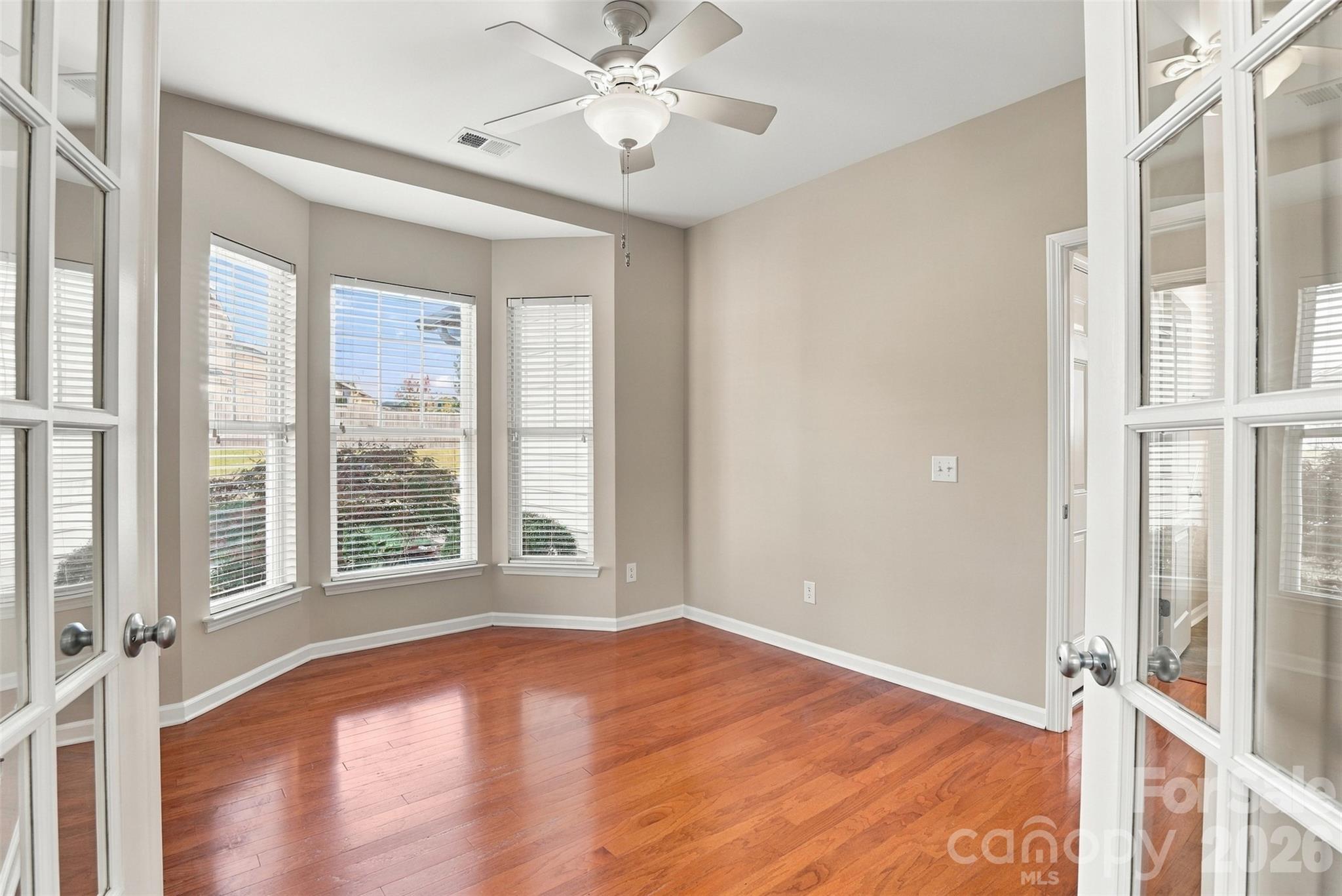 Bedroom #3 with bay windows, charming french doors and closet! - 608 Goldflower Drive, Rock Hill