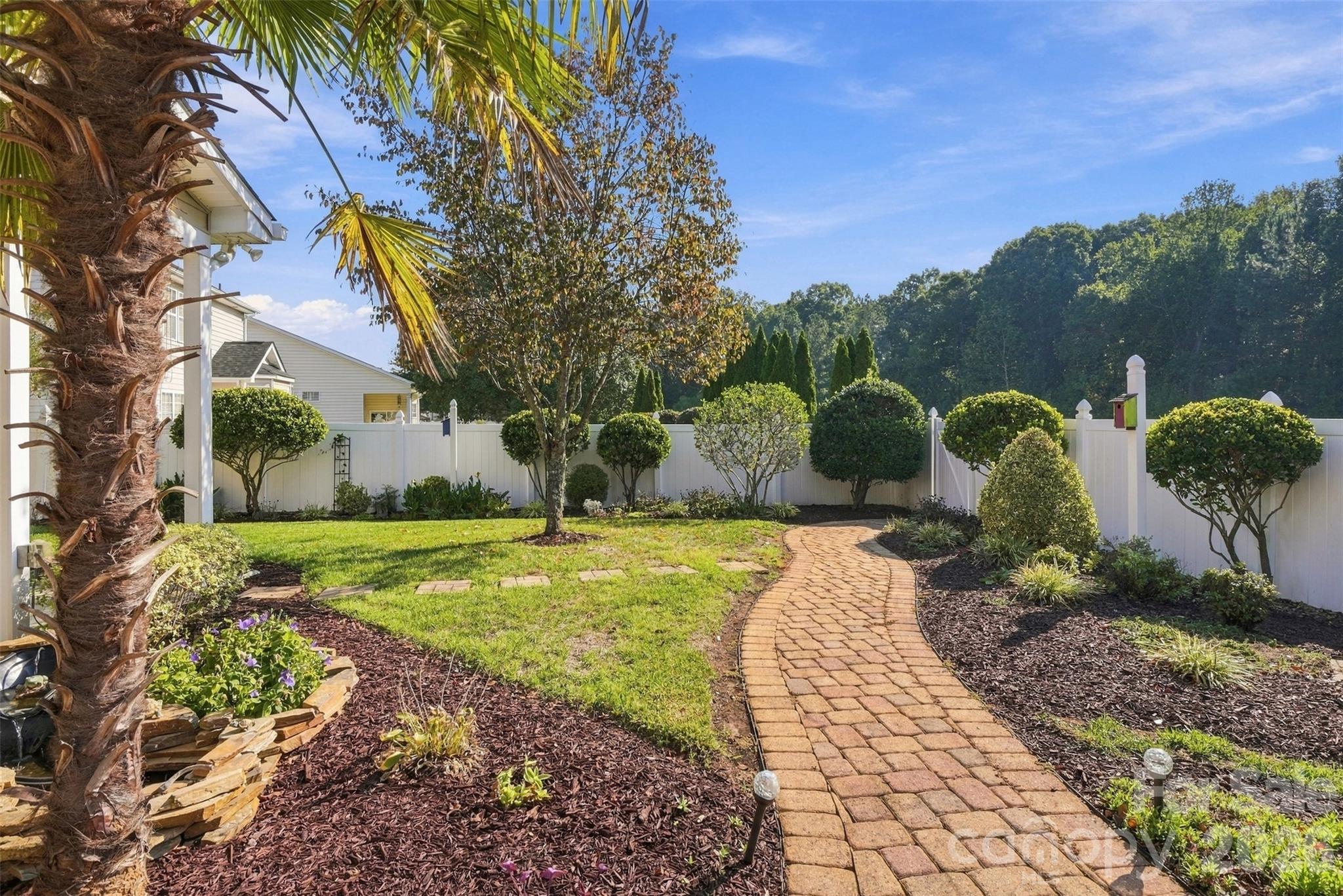 Meandering brick walkway flows through the back yard garden! - 608 Goldflower Drive, Rock Hill