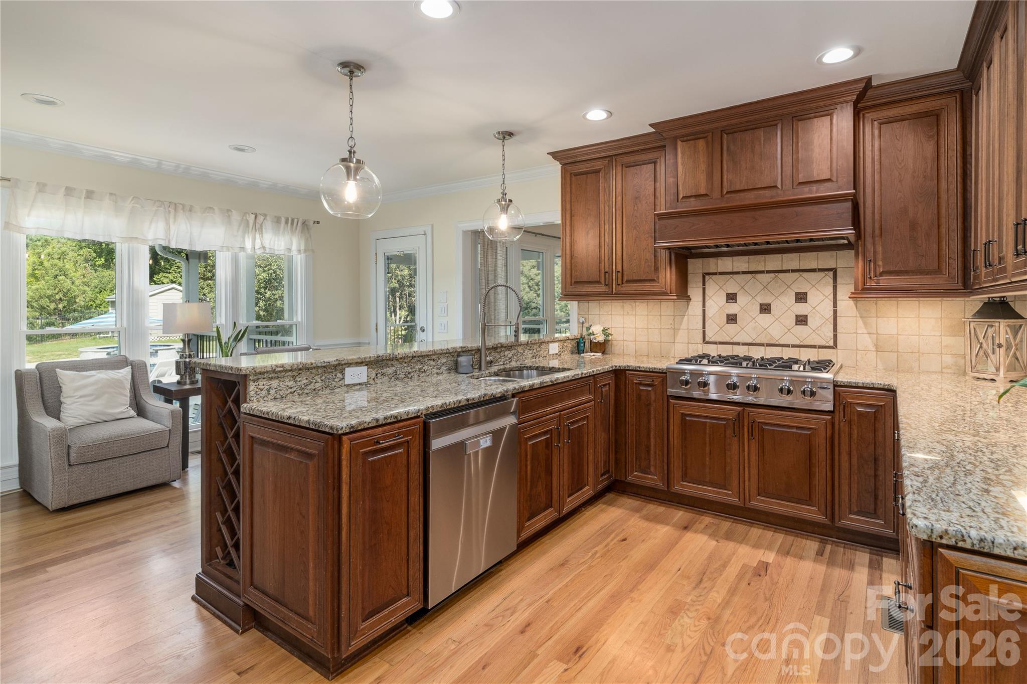 Entertain in the Chef's Kitchen with top of the line appliances and custom cabinetry - 16647 Greenfarm Road, Huntersville