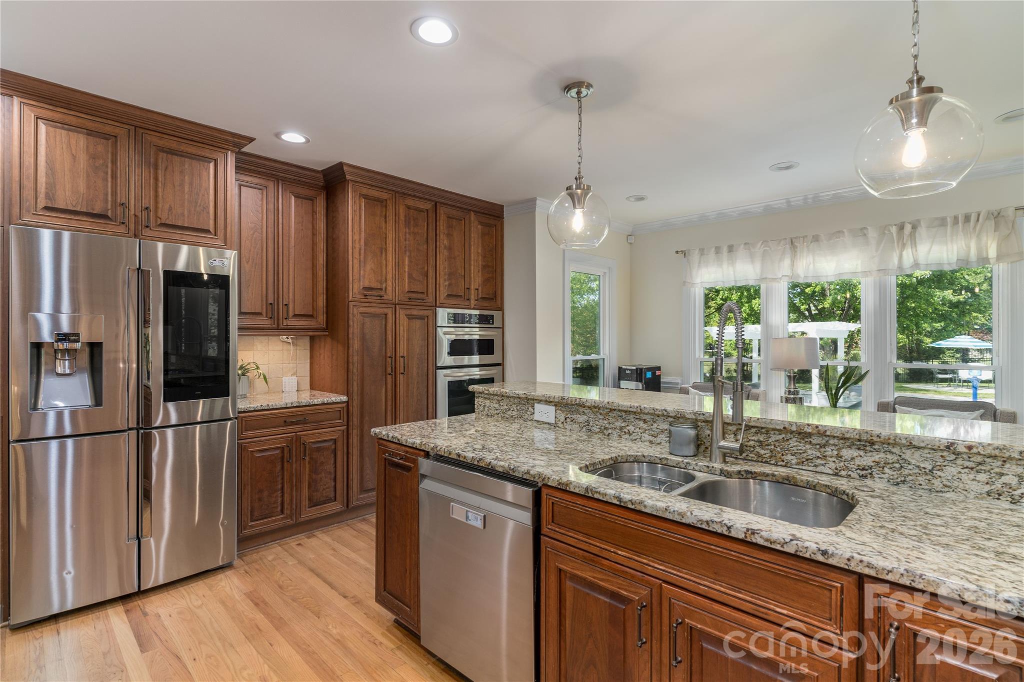 Entertain in the Chef's Kitchen with top of the line appliances and custom cabinetry - 16647 Greenfarm Road, Huntersville