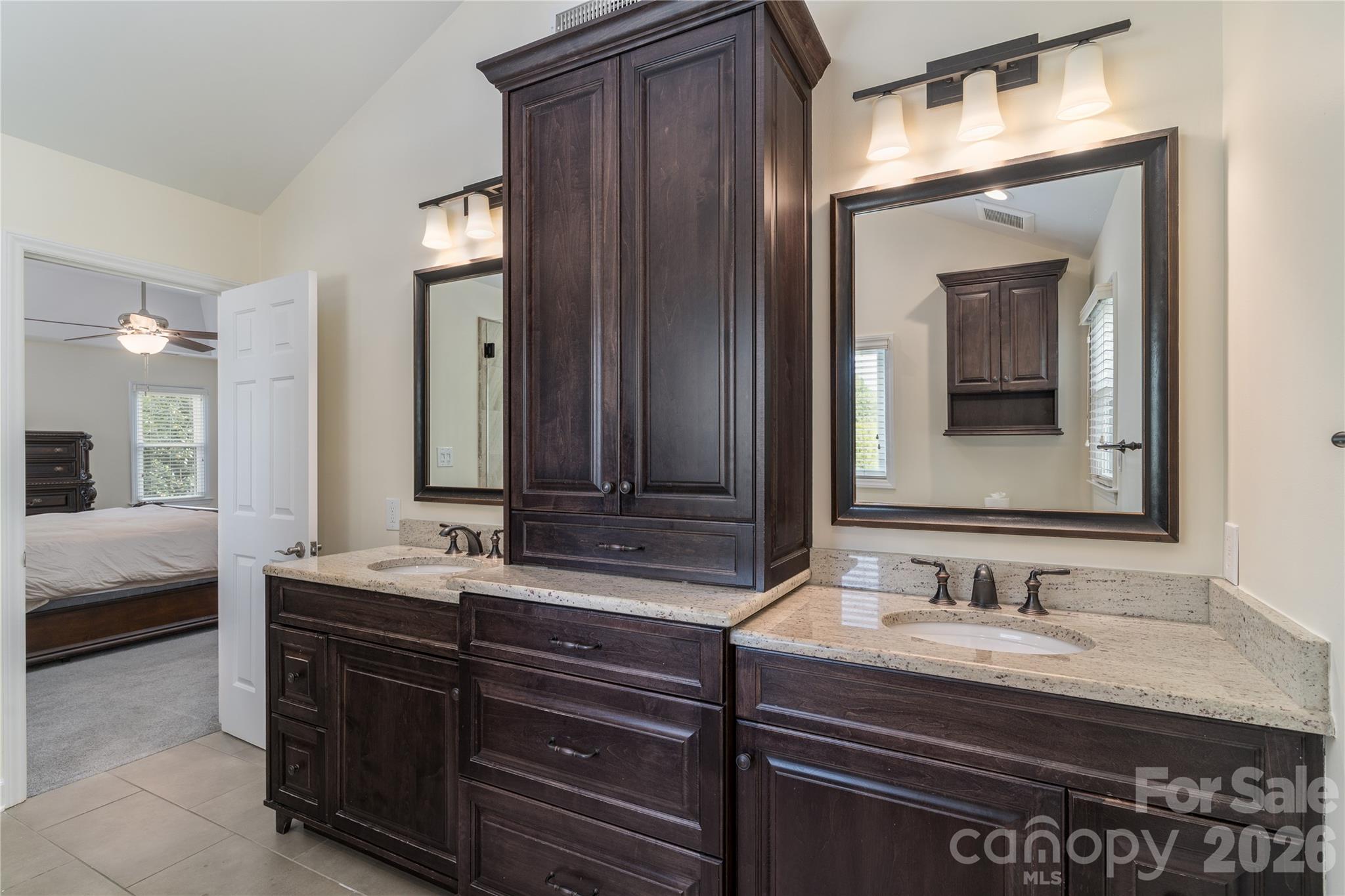 The luxurious Ensuite Master Bathroom has custom cabinetry, along with granite and marble - 16647 Greenfarm Road, Huntersville