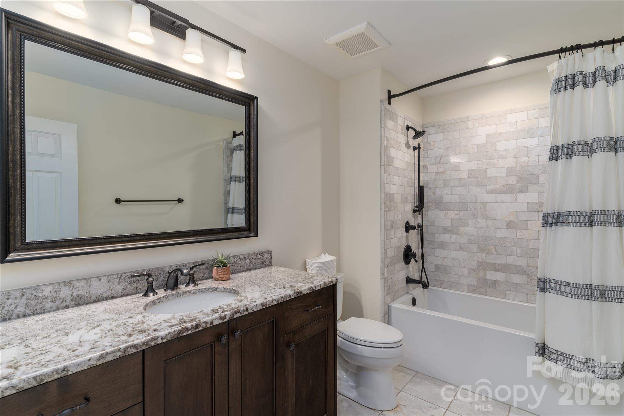 The Full Bathroom for Bedrooms #2 and #3 is luxurious with marble and custom cabinetry - 16647 Greenfarm Road, Huntersville