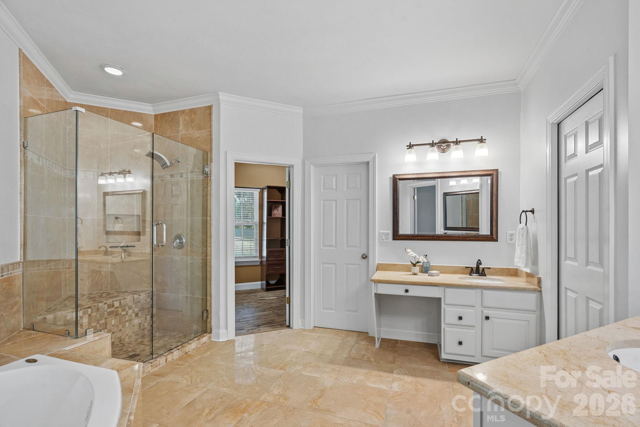 Primary bathroom with 2 vanities, garden tub and shower - 148 Sunrise Circle, Mooresville