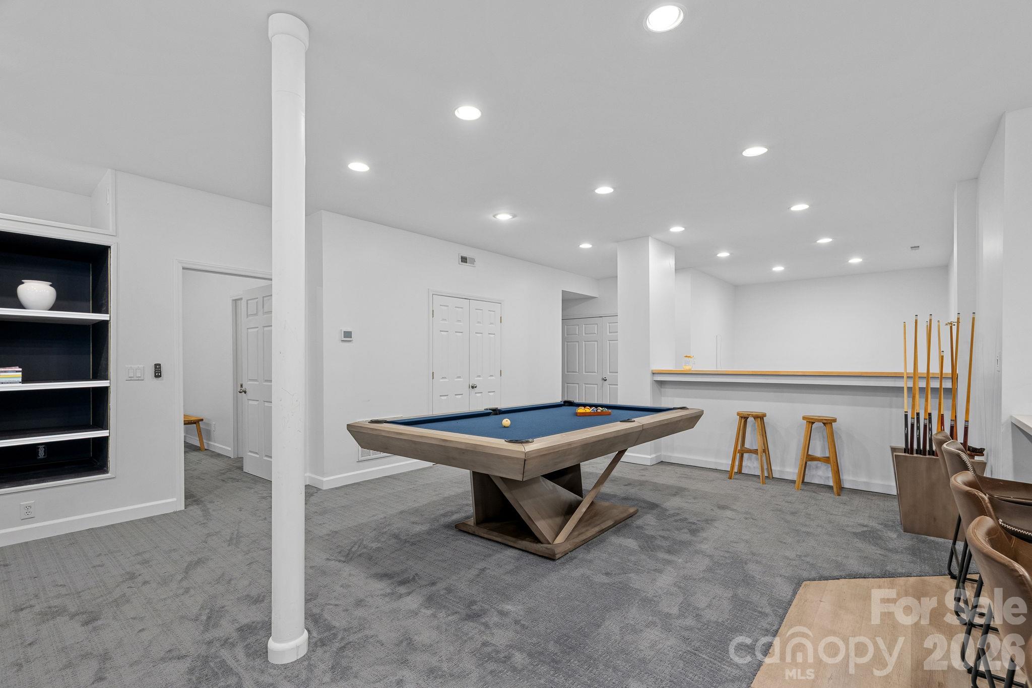 Extra space for a pool table and additional flex space beyond the bar area - 148 Sunrise Circle, Mooresville