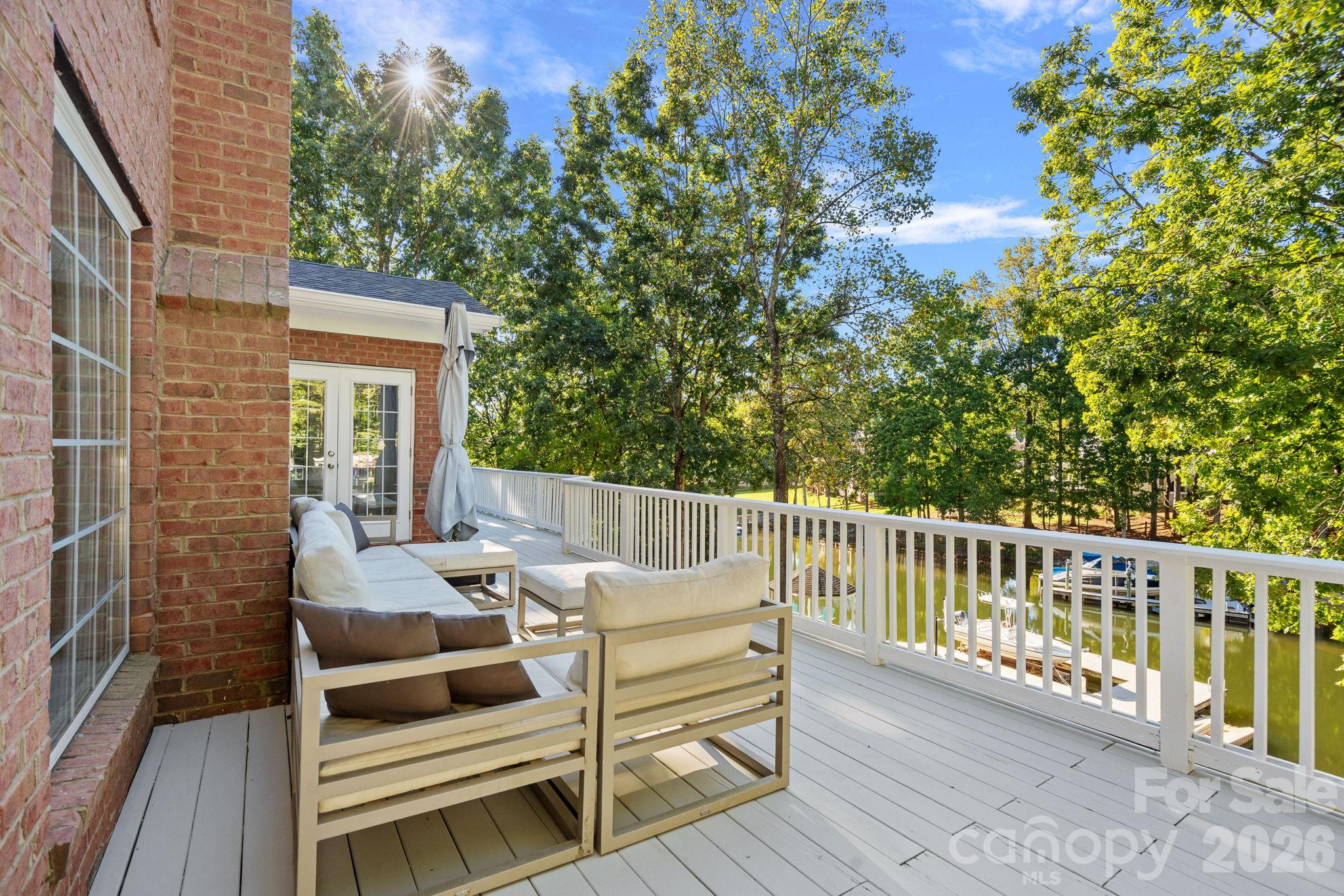 The other side of the upstairs patio, even further down there is another seating area - 148 Sunrise Circle, Mooresville