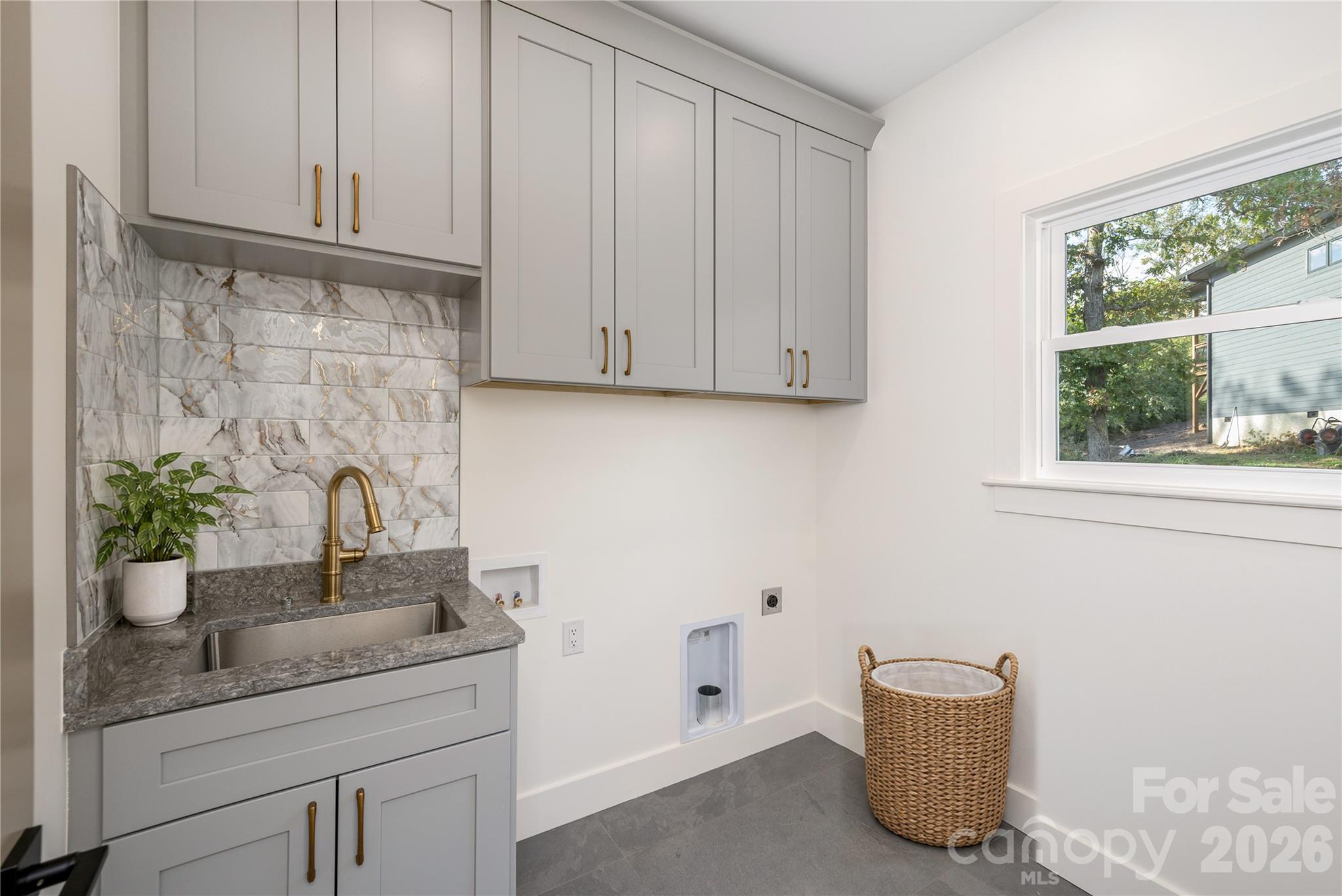 Laundry room with sink on main level - 159 Meadow Breeze Road, Arden