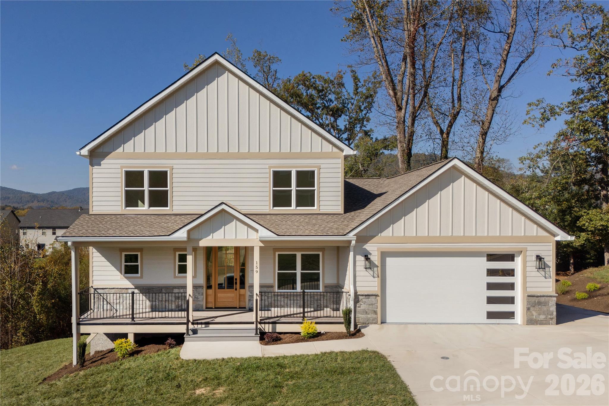 Front of home with large driveway - 159 Meadow Breeze Road, Arden