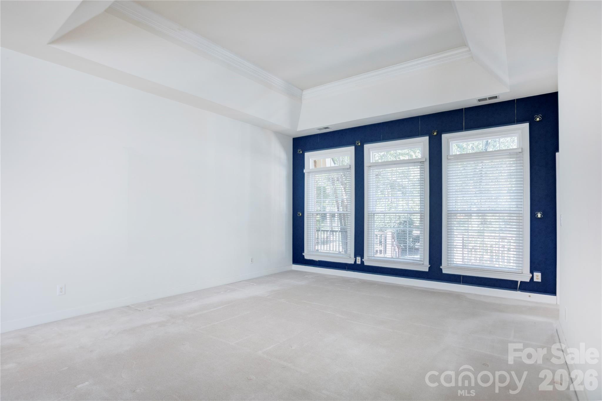 Living room with high tray ceilings and large windows - 890 Lyerly Ridge Road NW, Concord