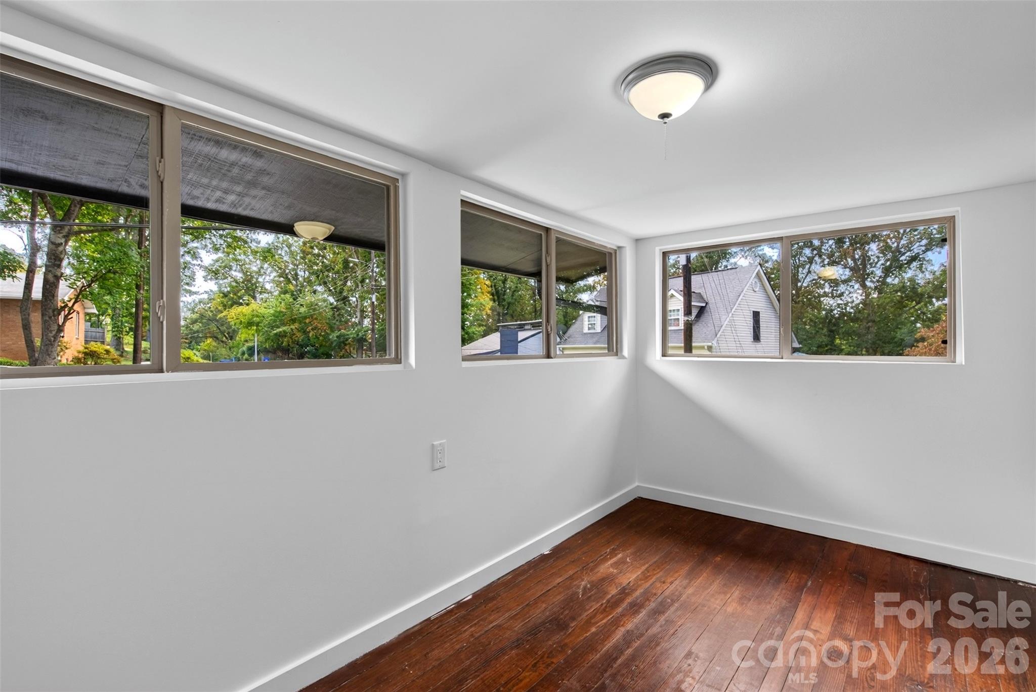 A sunroom upstairs is not counted in heated living space due to a ceiling height of 6.6. - 64 Pine Cone Drive, Asheville
