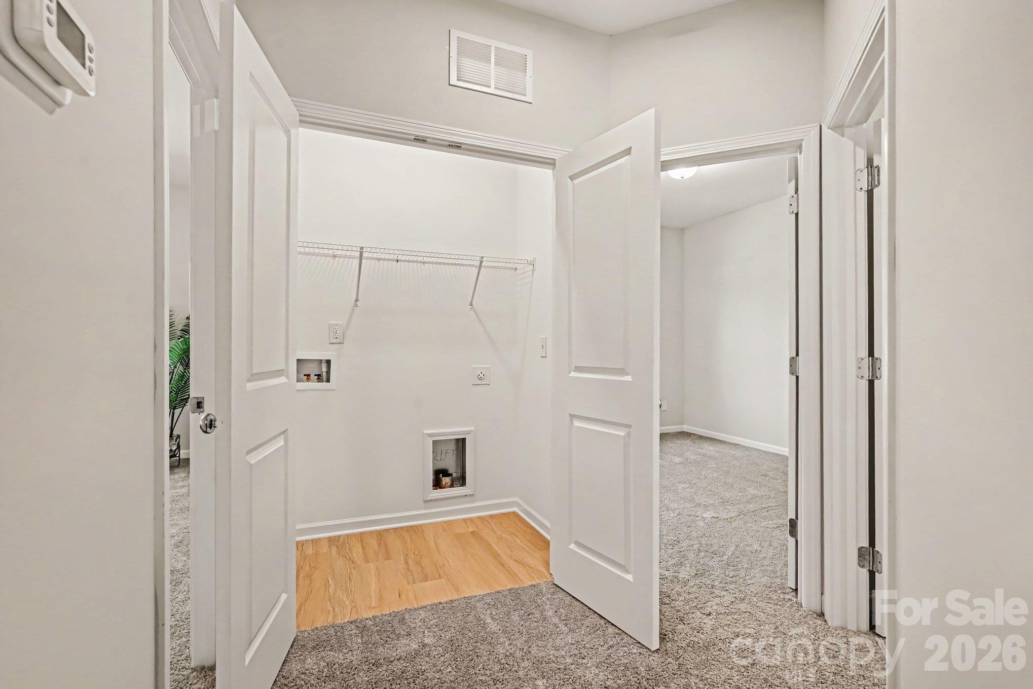 Conveniently located laundry closet is next to the bedrooms on upper level. This will make clothes washing a breeze! - 121 Buffalo Avenue NW, Concord