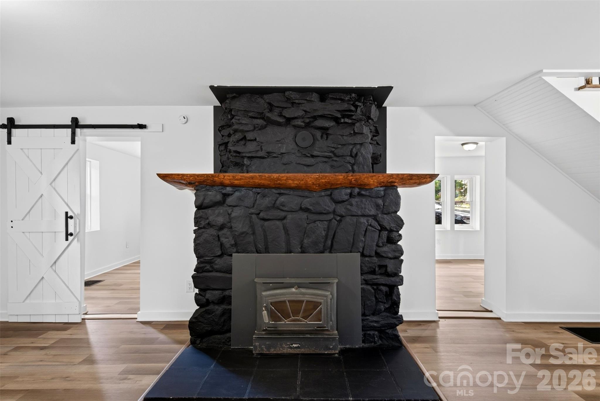 Beautiful original mantel over the wood burning stove - 64 and 56 Pine Cone Drive, Asheville