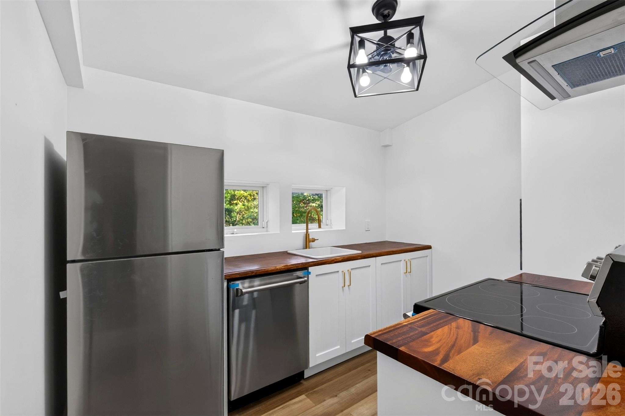 Updated kitchen with new appliances, cabinets and counter tops. - 64 and 56 Pine Cone Drive, Asheville