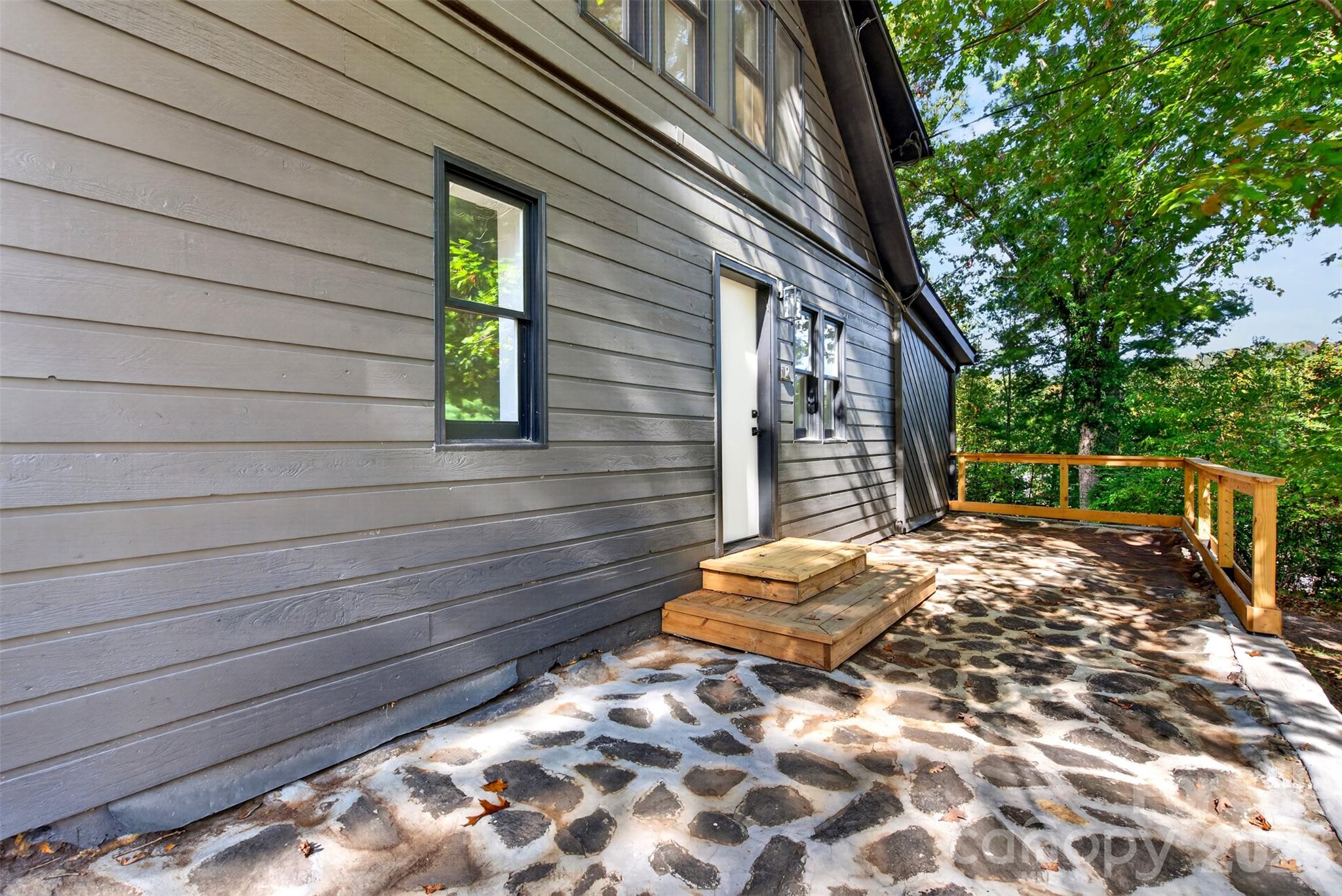 Beautiful stone patio off of 64. - 64 and 56 Pine Cone Drive, Asheville