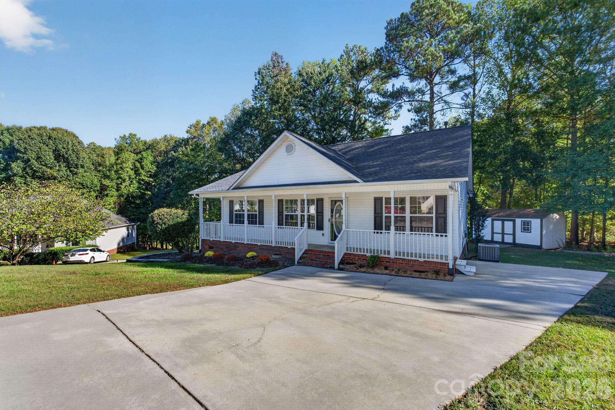 Generous paved driveway leading up to this beautiful Rock Hill retreat. - 702 Painted Lady Court, Rock Hill