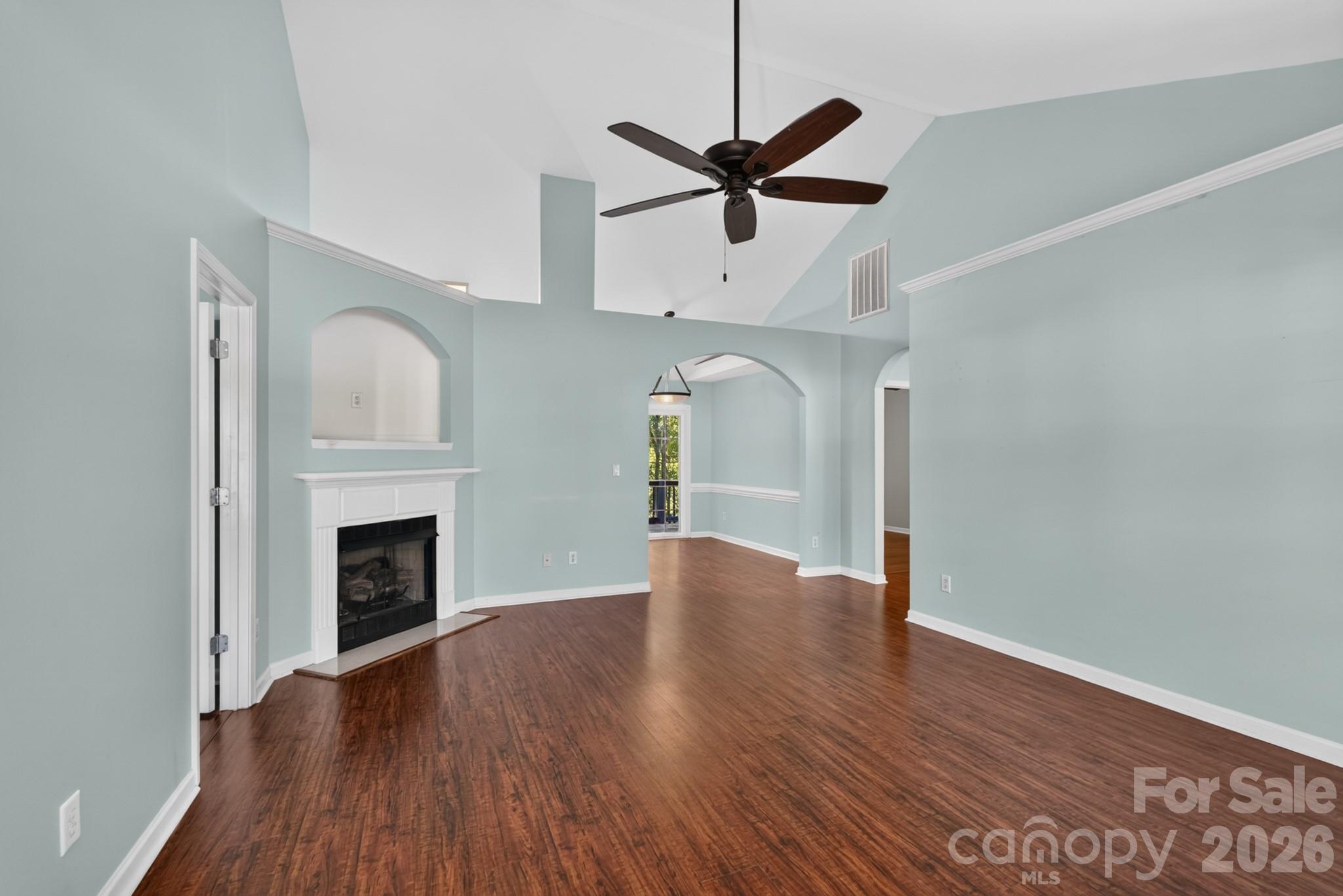 Interior accents and continuous hardwood flooring elevate the sense of airiness throughout. - 702 Painted Lady Court, Rock Hill