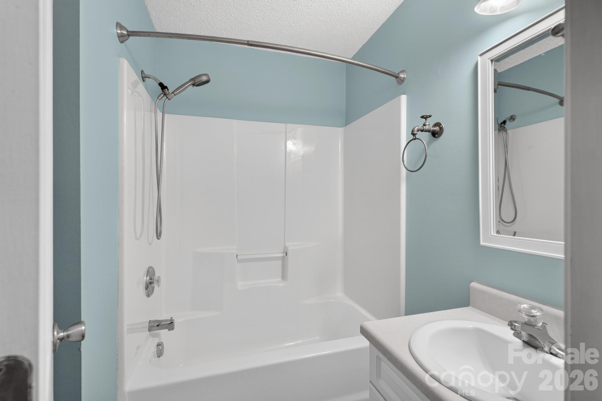 Clean full bathroom equipped with a tub/shower combination. - 702 Painted Lady Court, Rock Hill