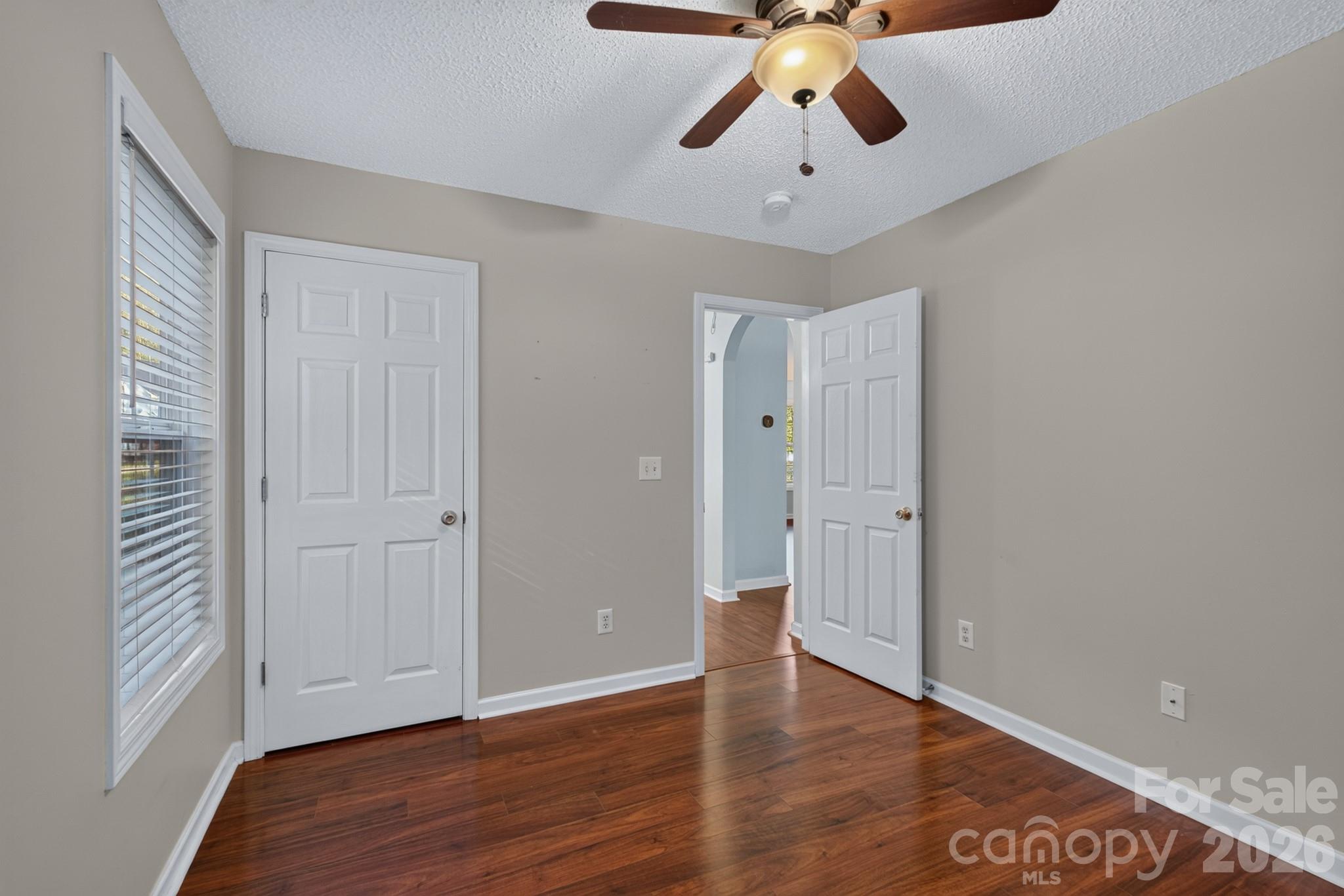 Versatile guest bedroom, ideal for a dedicated home office, nursery, or hobby room. - 702 Painted Lady Court, Rock Hill