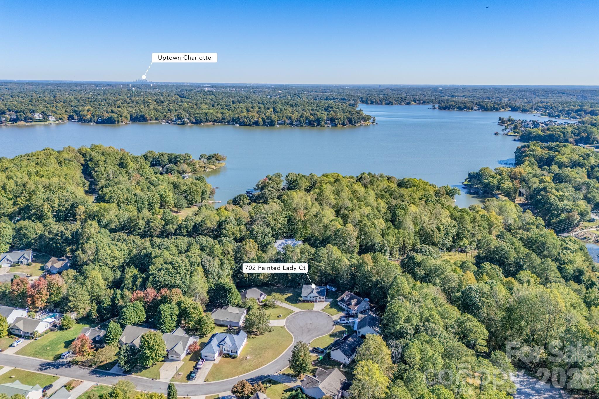 Aerial view showcasing the lush canopy of mature trees surrounding this quiet community and proximity to Uptown Charlotte. - 702 Painted Lady Court, Rock Hill