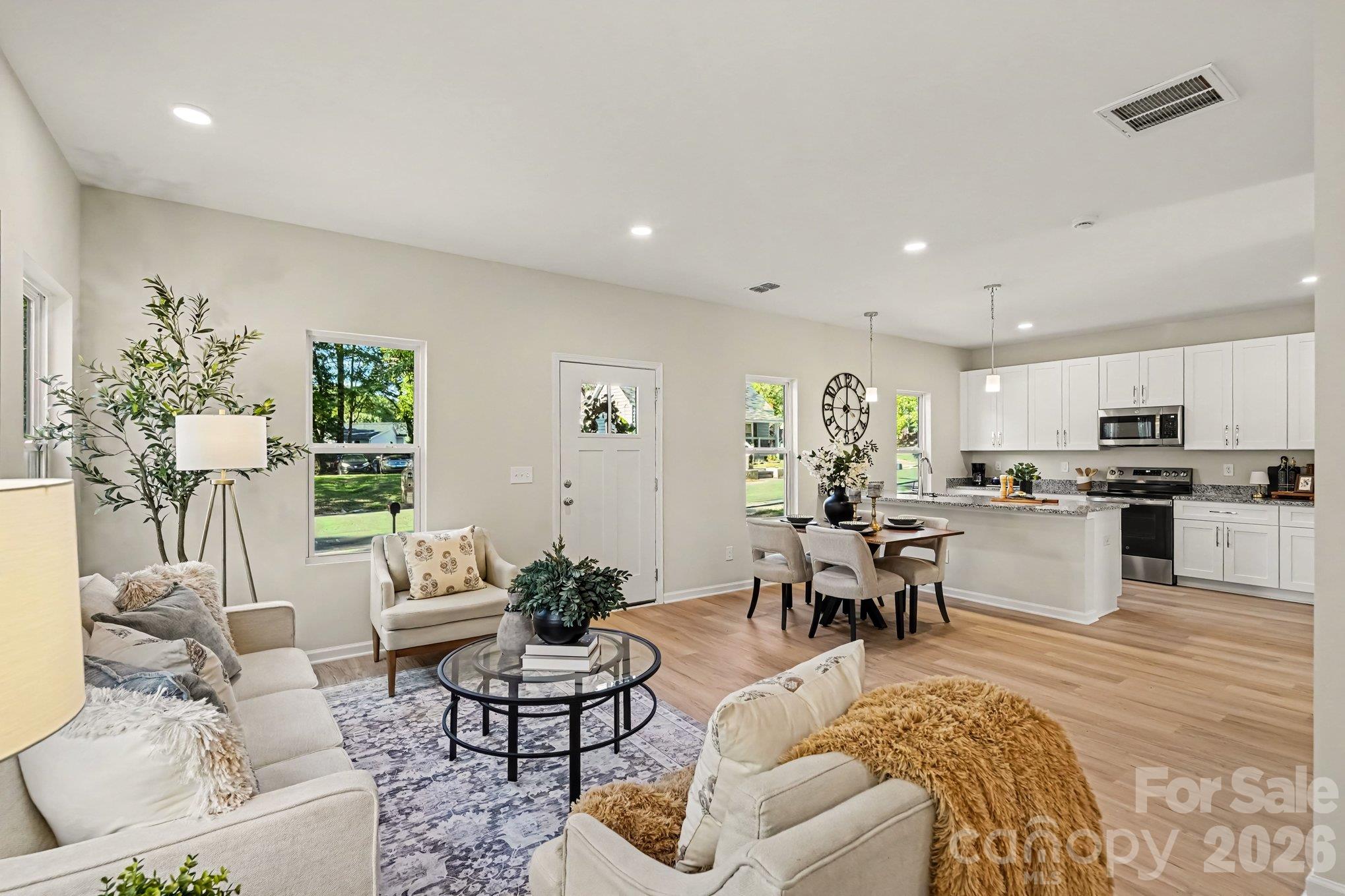 Another view of the main level living area. This photo is a representation of home taken from identical home next door. Actual photos are in process. - 125 Buffalo Avenue NW, Concord