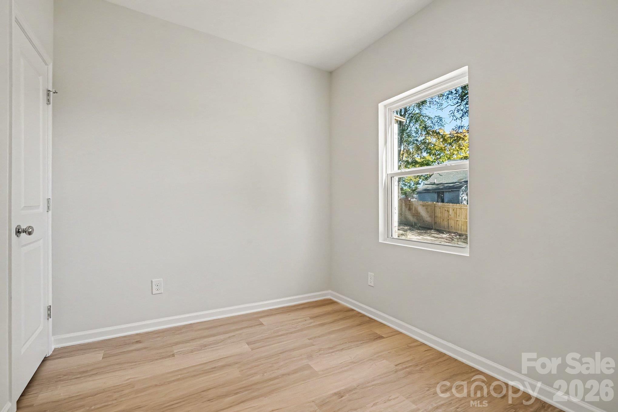 This is the office on the main level which offers options for craft/hobby space, storage and play room. This photo is a representation of home taken from identical home next door. Actual photos are in process. - 125 Buffalo Avenue NW, Concord