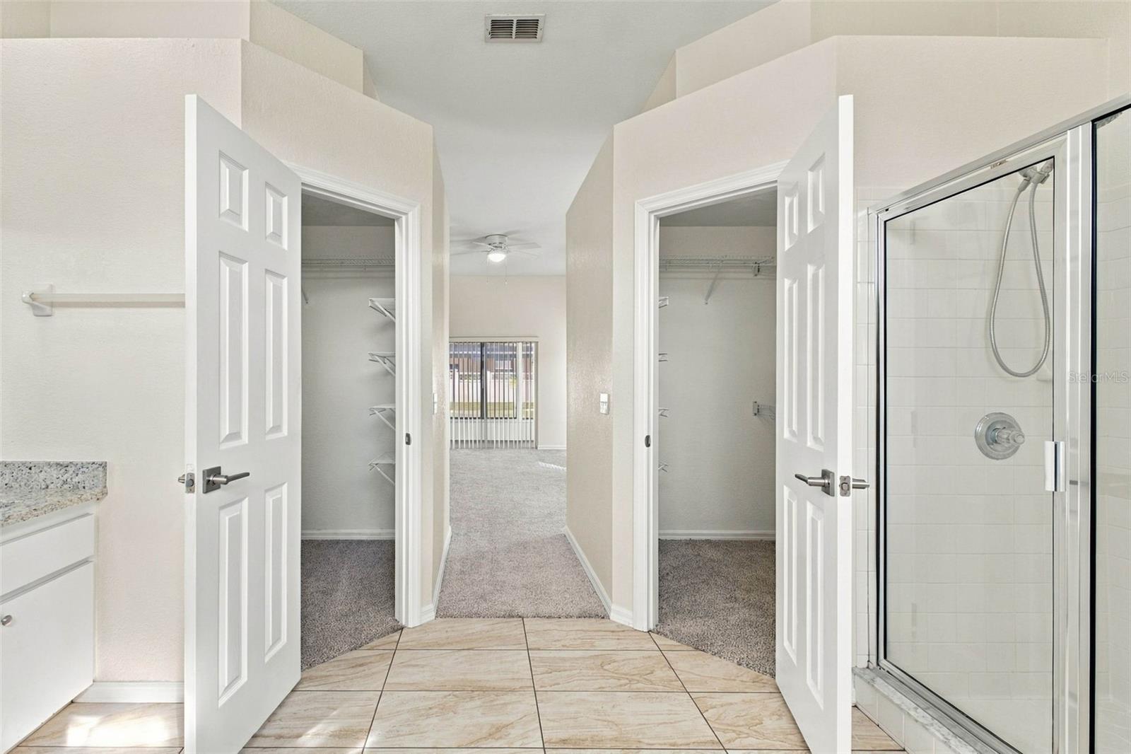His/Her walk-in closets - 131 RUBY LAKE DR, WINTER HAVEN