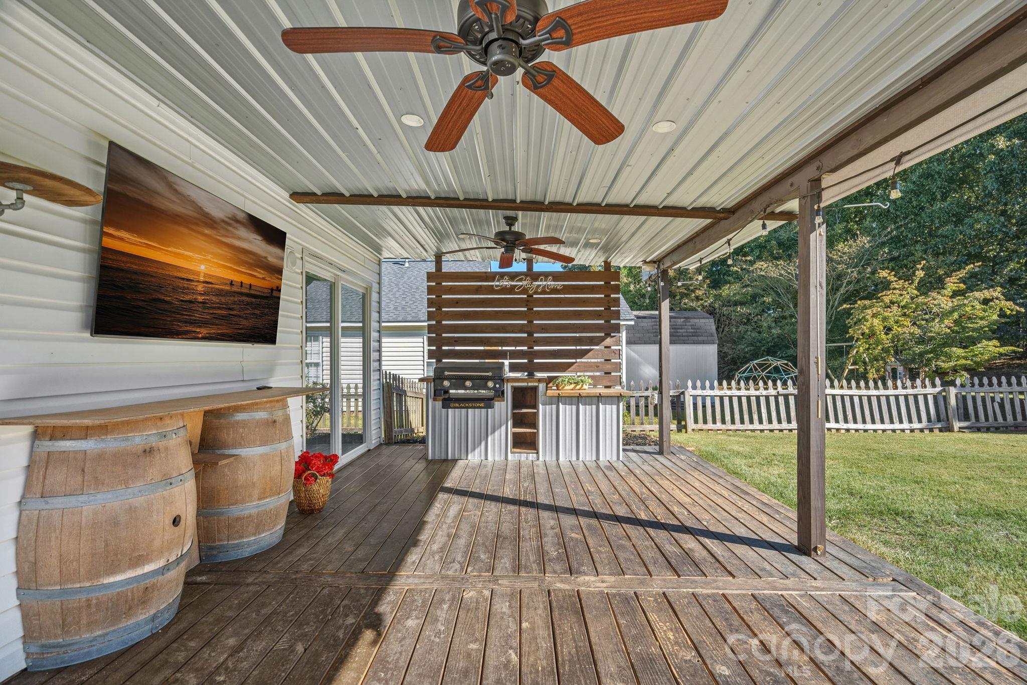 Back patio with Blackstone & grill - 130 Camforth Drive, Mooresville