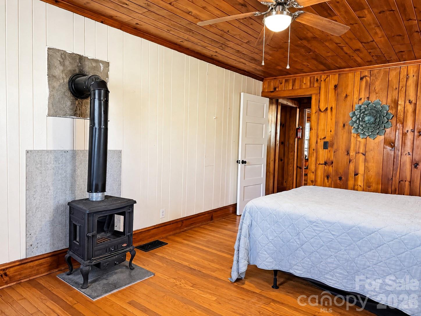 Primary Bedroom w/ wood stove - 683 McDaniel Road, Lake Lure