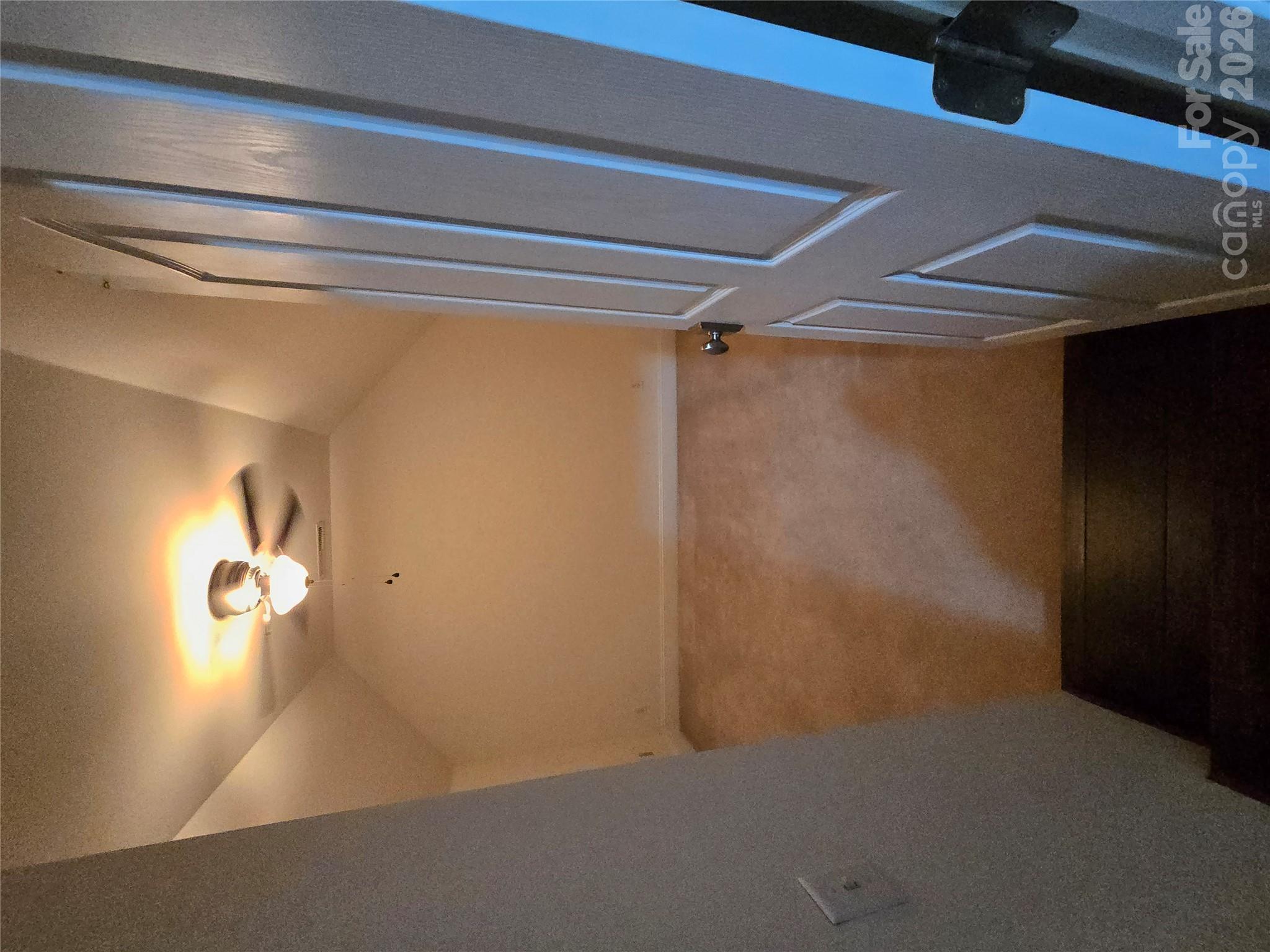 Step down into extra room (no window) with a closet and access to floored attic space off from the bonus area - 3008 Scottsdale Lane, Matthews