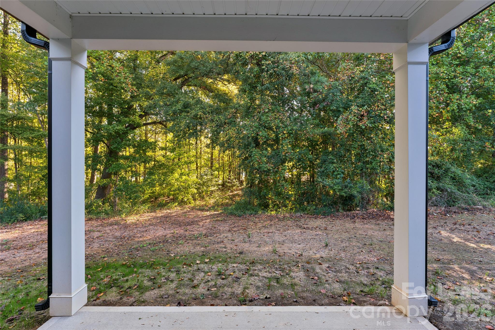 Covered back patio overlooking private backyard - 11924 Crabapple Lane, Huntersville
