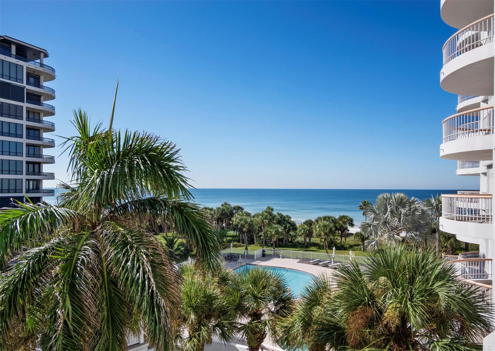 Your direct gulf view overlooks pool & spa area, with the deeded beach beyond. - 455 LONGBOAT CLUB RD #402, LONGBOAT KEY
