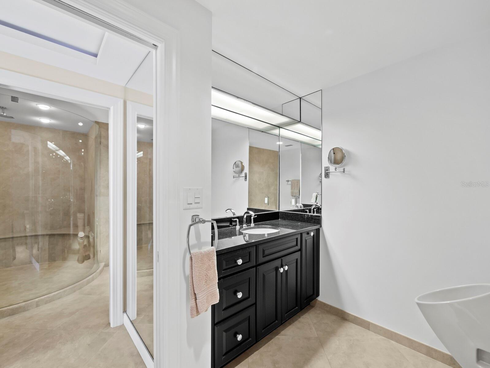 Three-fixtured Half Bath within Primary Suite - 455 LONGBOAT CLUB RD #402, LONGBOAT KEY