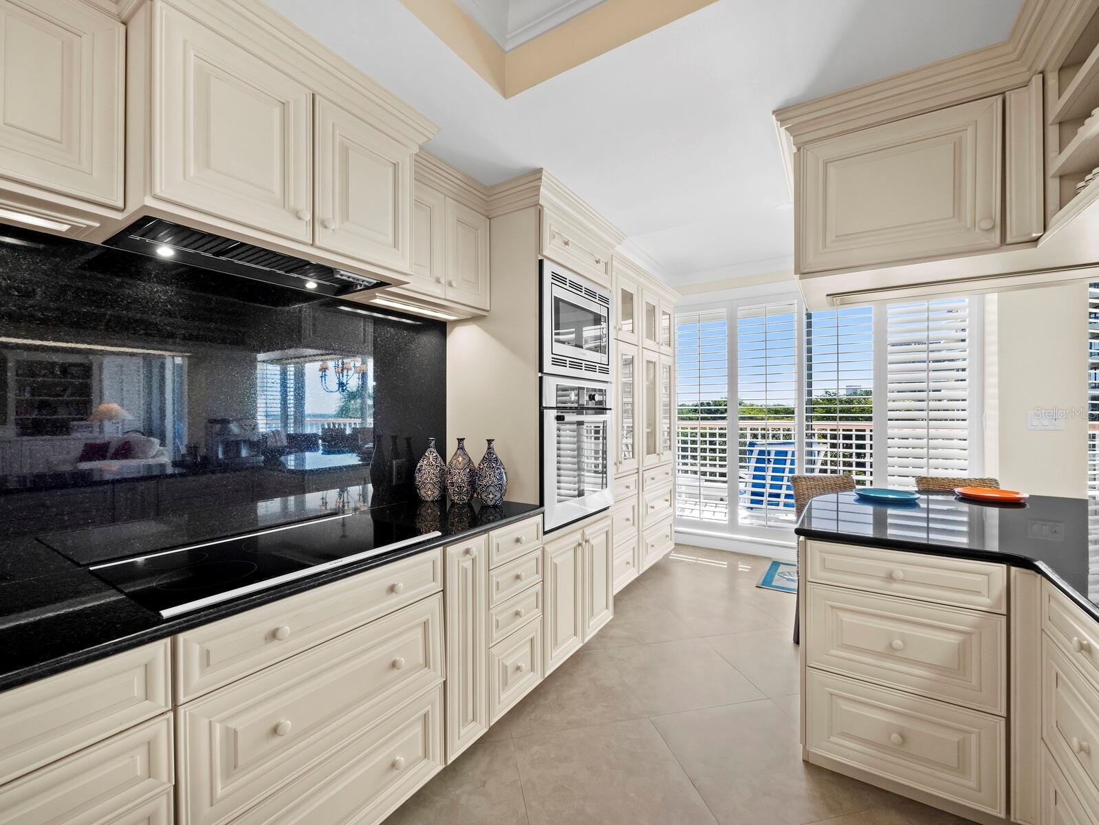 Kitchen highlights include Bosch appliances, expansive counter tops and tremendous storage - 455 LONGBOAT CLUB RD #402, LONGBOAT KEY