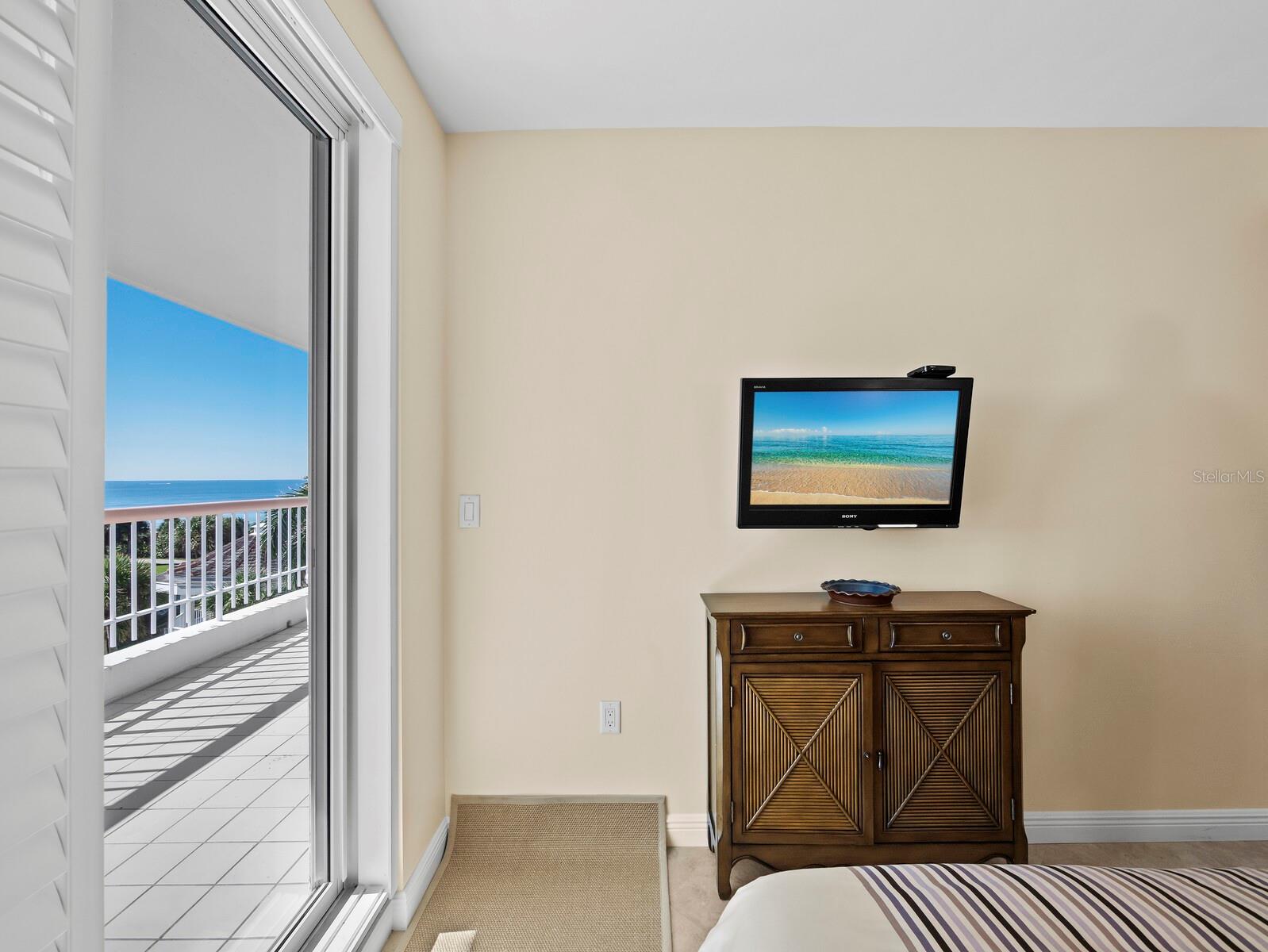 Guest bedroom with lovely views and private access to large terrace. - 455 LONGBOAT CLUB RD #402, LONGBOAT KEY