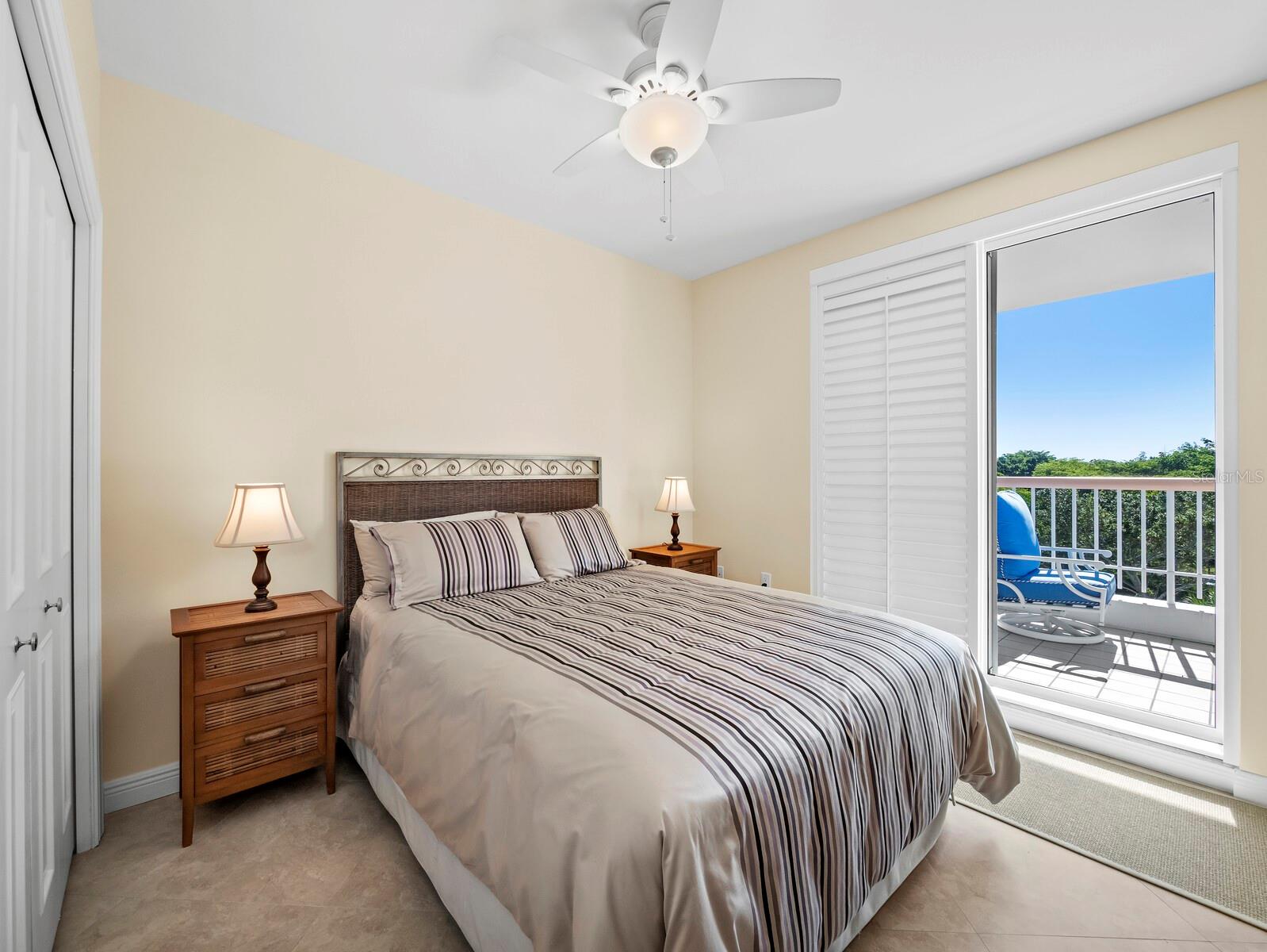 Comfortable Guest bedroom opposite the Primary with large closet, private access to large balcony. - 455 LONGBOAT CLUB RD #402, LONGBOAT KEY