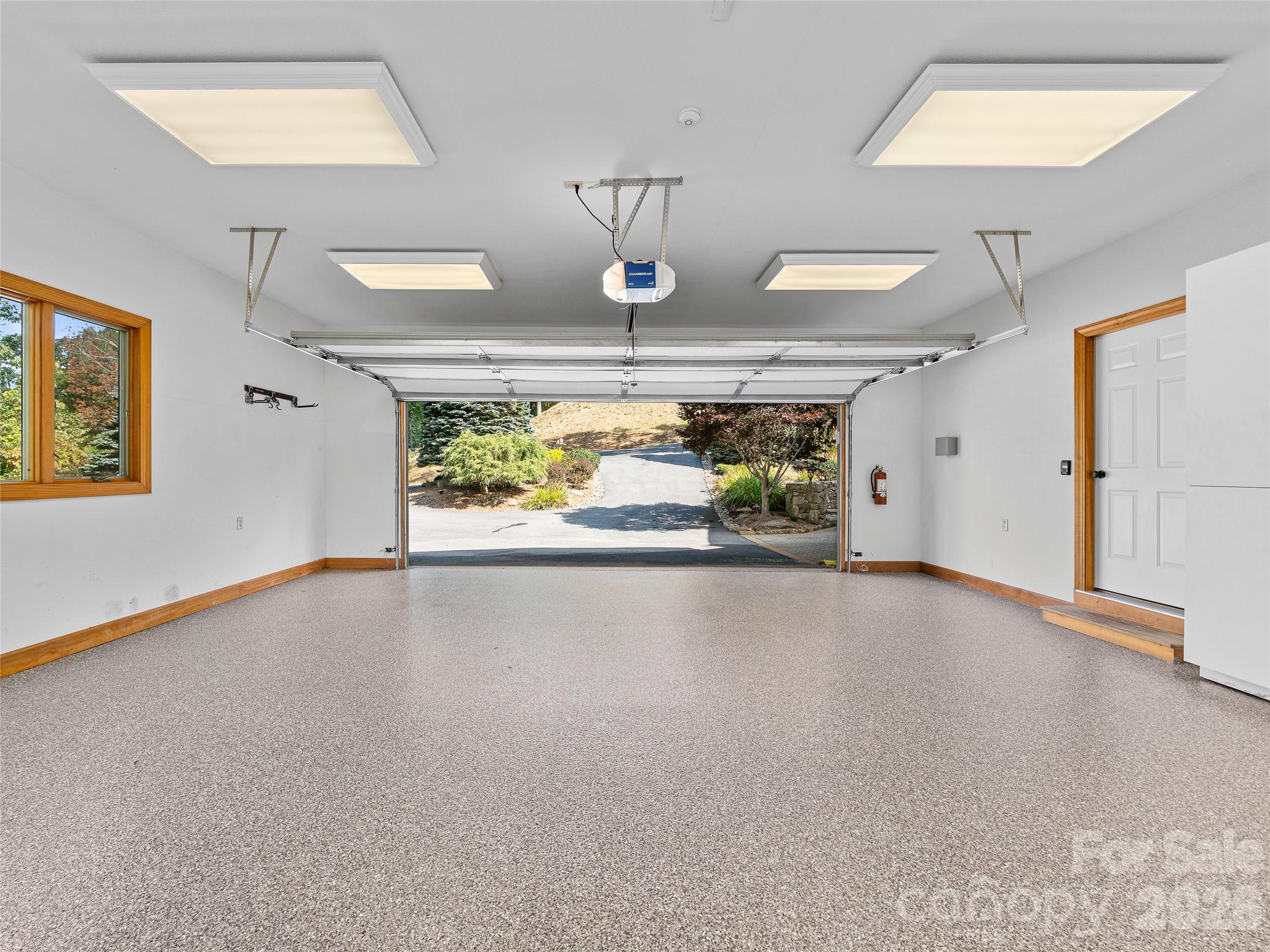 New epoxy flooring gives the garage a clean, polished finish - 151 Austin Mountain Drive, Burnsville