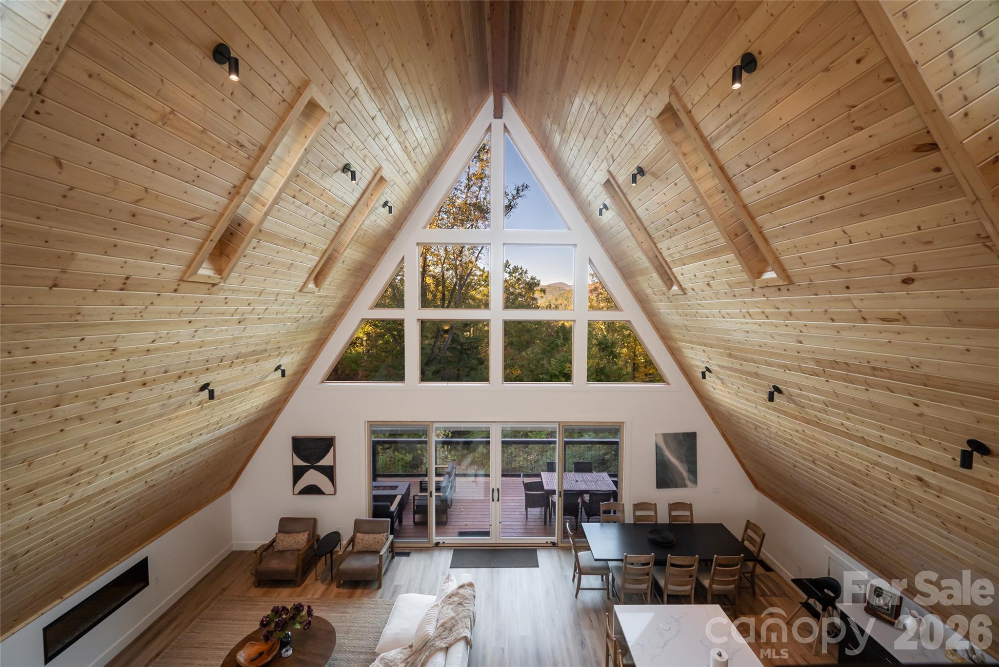 Wall of windows overlooking the mountains from the great room - 125 Carolina Lily Lane, Asheville