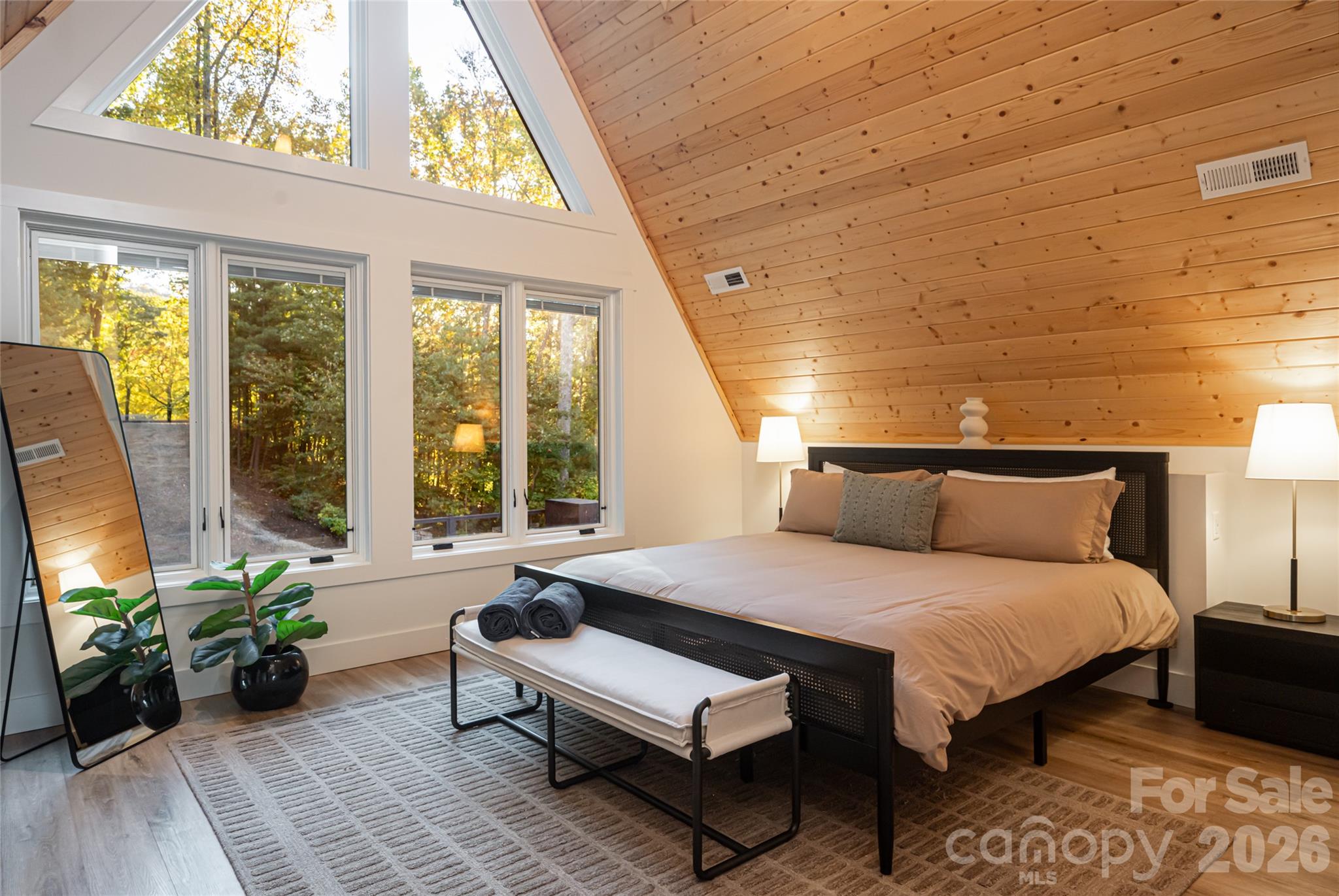 Primary bedroom on the second floor with vaulted ceiling - 125 Carolina Lily Lane, Asheville