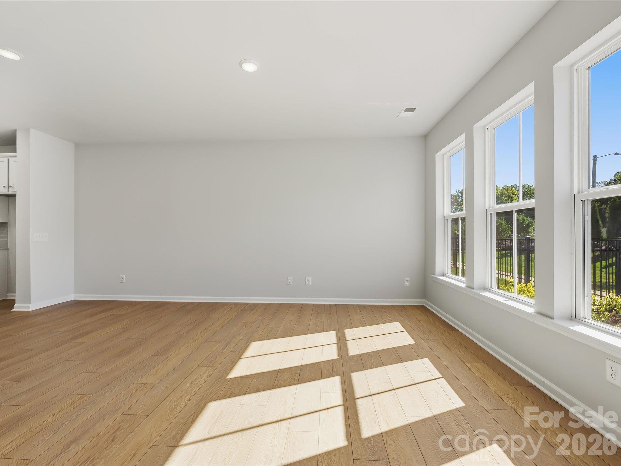 Living Room with an Abundance of Natural Light - 6063 White Aster Lane, Charlotte