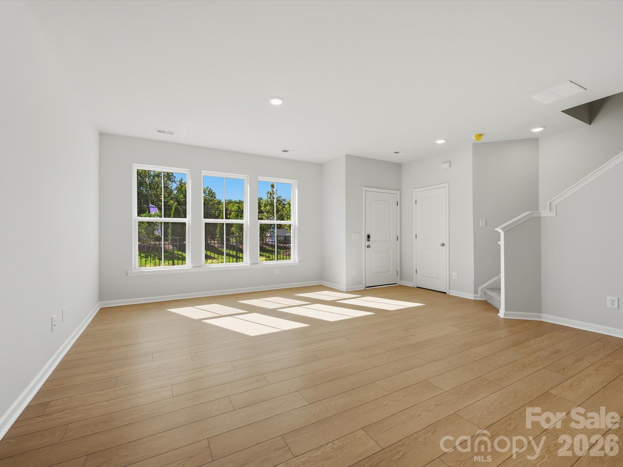Living Room with an Abundance of Natural Light - 6063 White Aster Lane, Charlotte