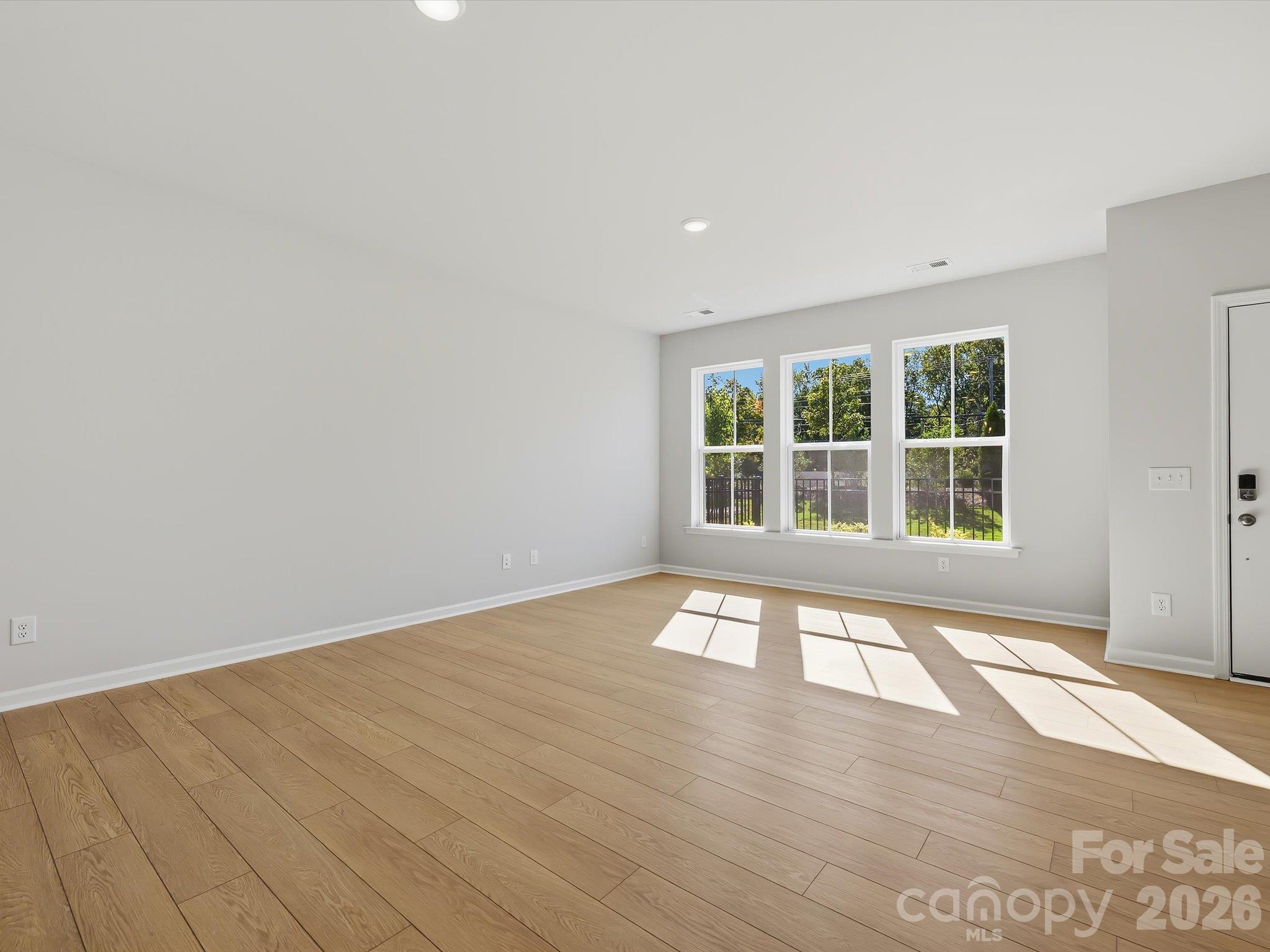 Living Room with an Abundance of Natural Light - 6063 White Aster Lane, Charlotte