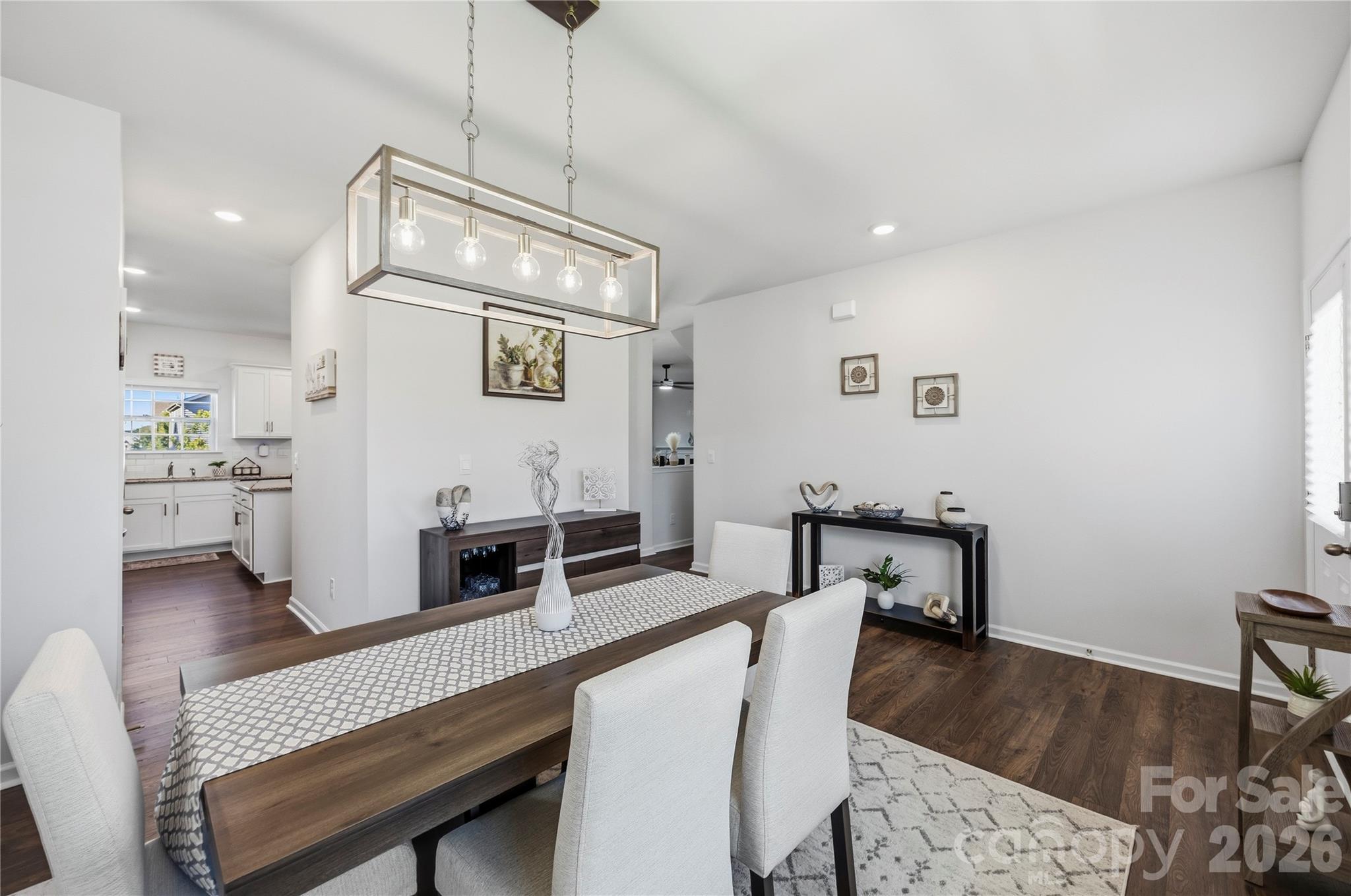 Formal Dining and Entry - pass through walk in pantry with wood shelving. - 9022 Poquoson Drive, Gastonia