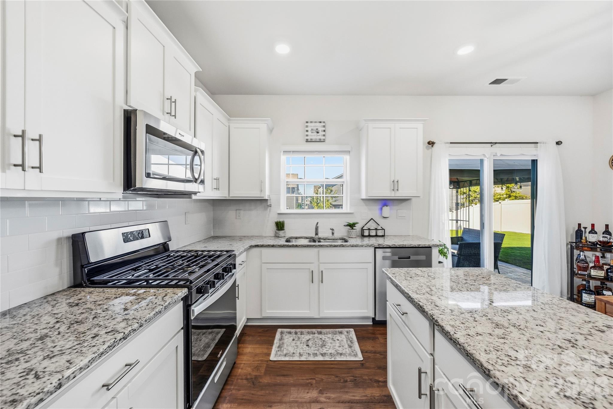 Open floor plan with plenty of counter space and storage. - 9022 Poquoson Drive, Gastonia