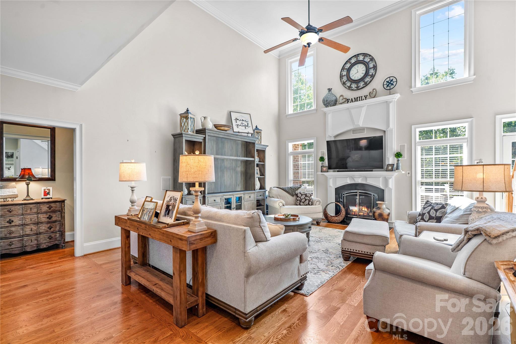 Two-story livingroom with hardwood floors and gas log fireplace - 220 Cedar Lake Drive, Statesville