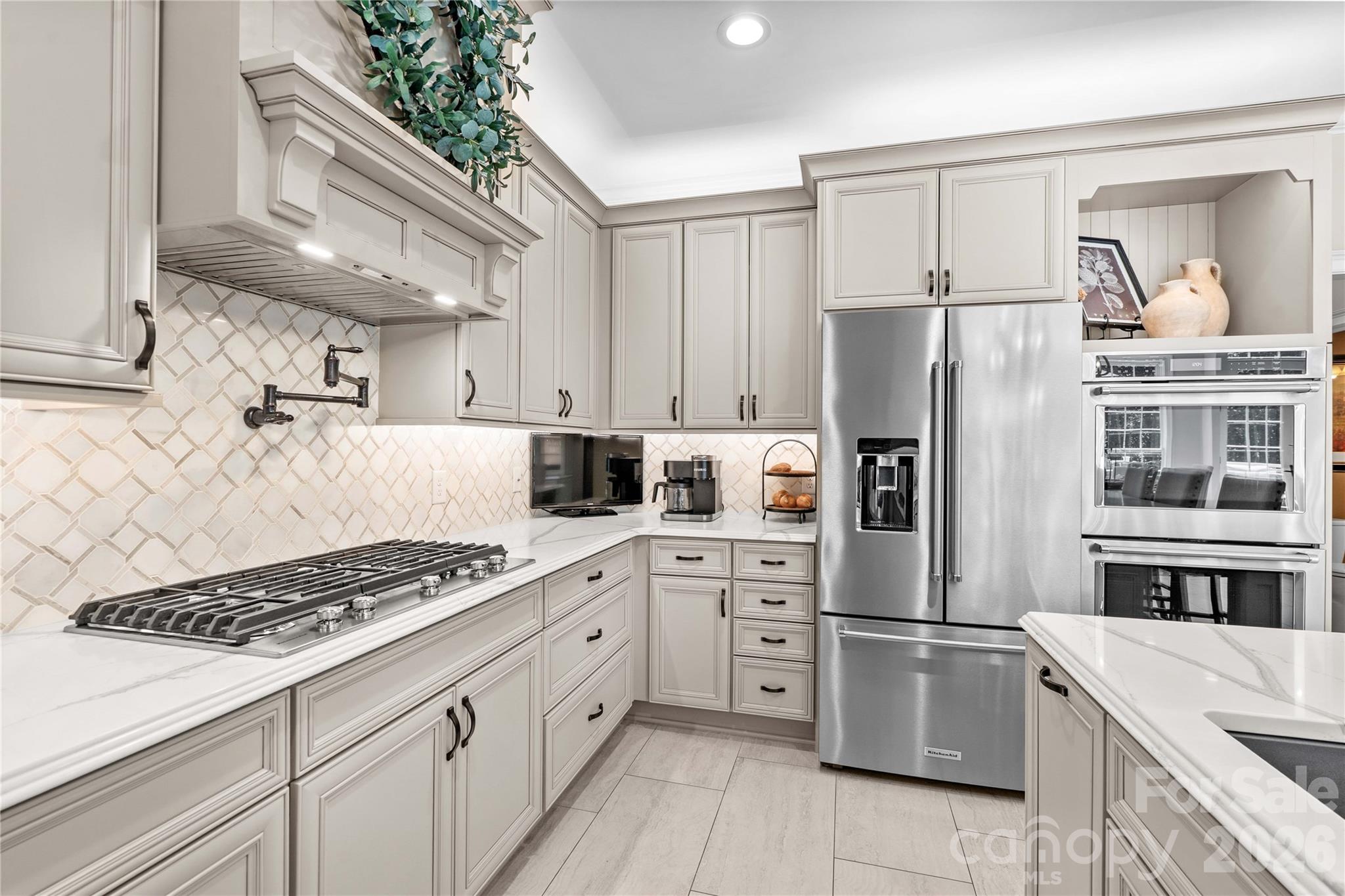 Updated kitchen 2021 includes updated appliances, cabinetry, countertops and tiled floors! - 220 Cedar Lake Drive, Statesville