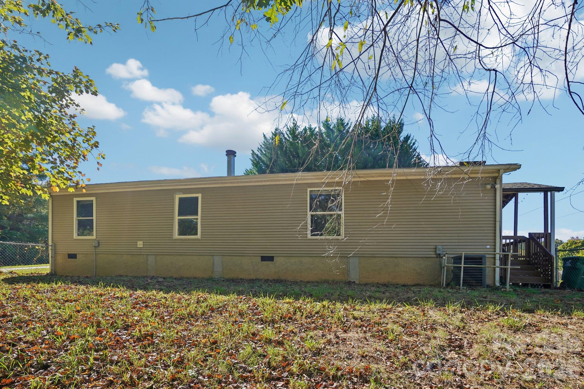 The back yard is fenced (close to 150 ft. linear run) -- - 202 Banyan Road, Candler