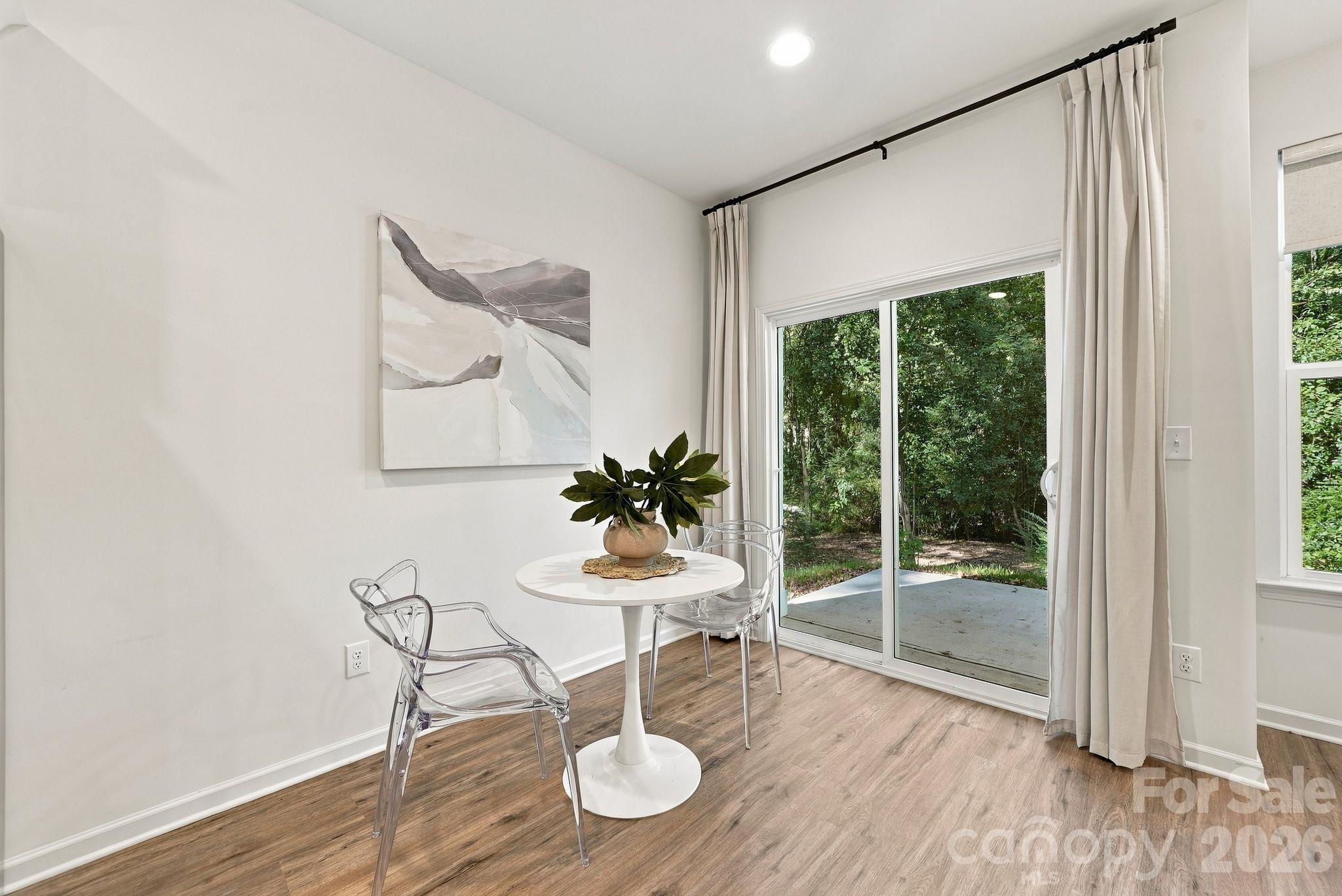 Dining area overlooks private backyard - 4715 Crestmont Drive, Charlotte